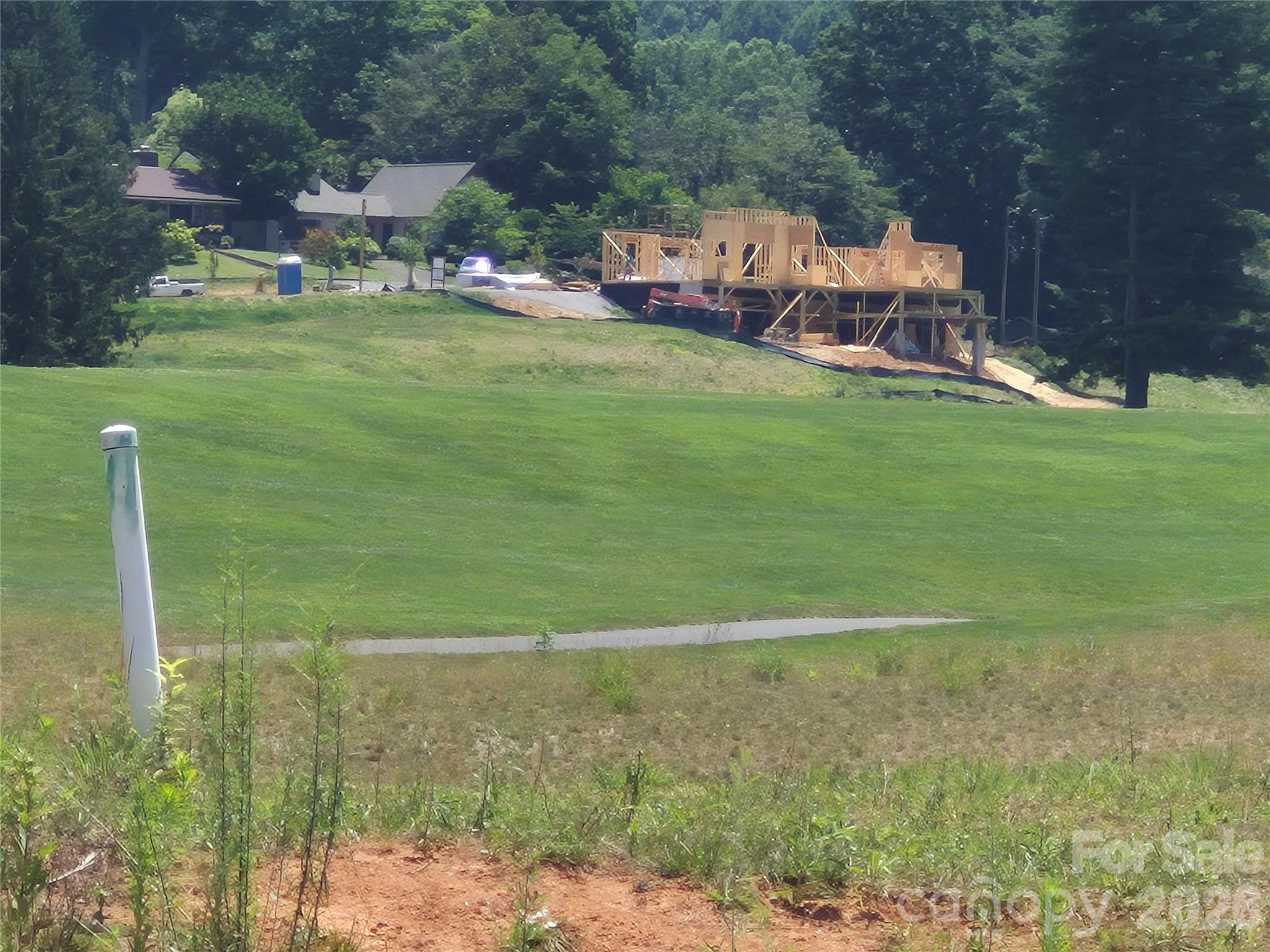 View of adjacent new construction from below - 30 Farmer Branch Lane, Waynesville