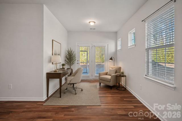 Virtually staged sitting area in primary bedroom - 116 Van Gogh Trail, Mount Holly