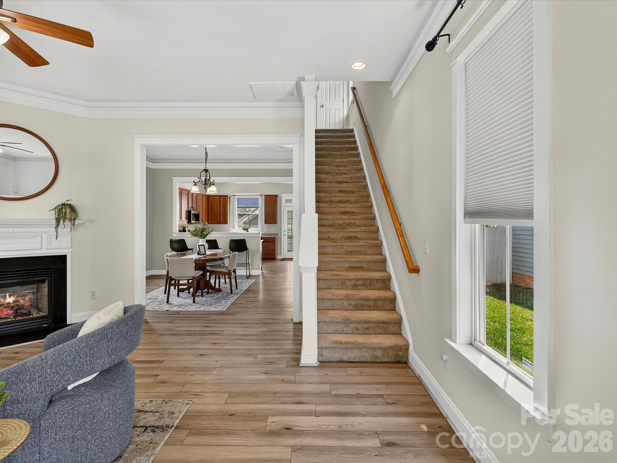 The welcoming foyer showcases durable flooring, abundant natural light, and an open stairwell that creates a bright, inviting flow throughout the main living areas. - 13106 Kennerly Drive, Huntersville
