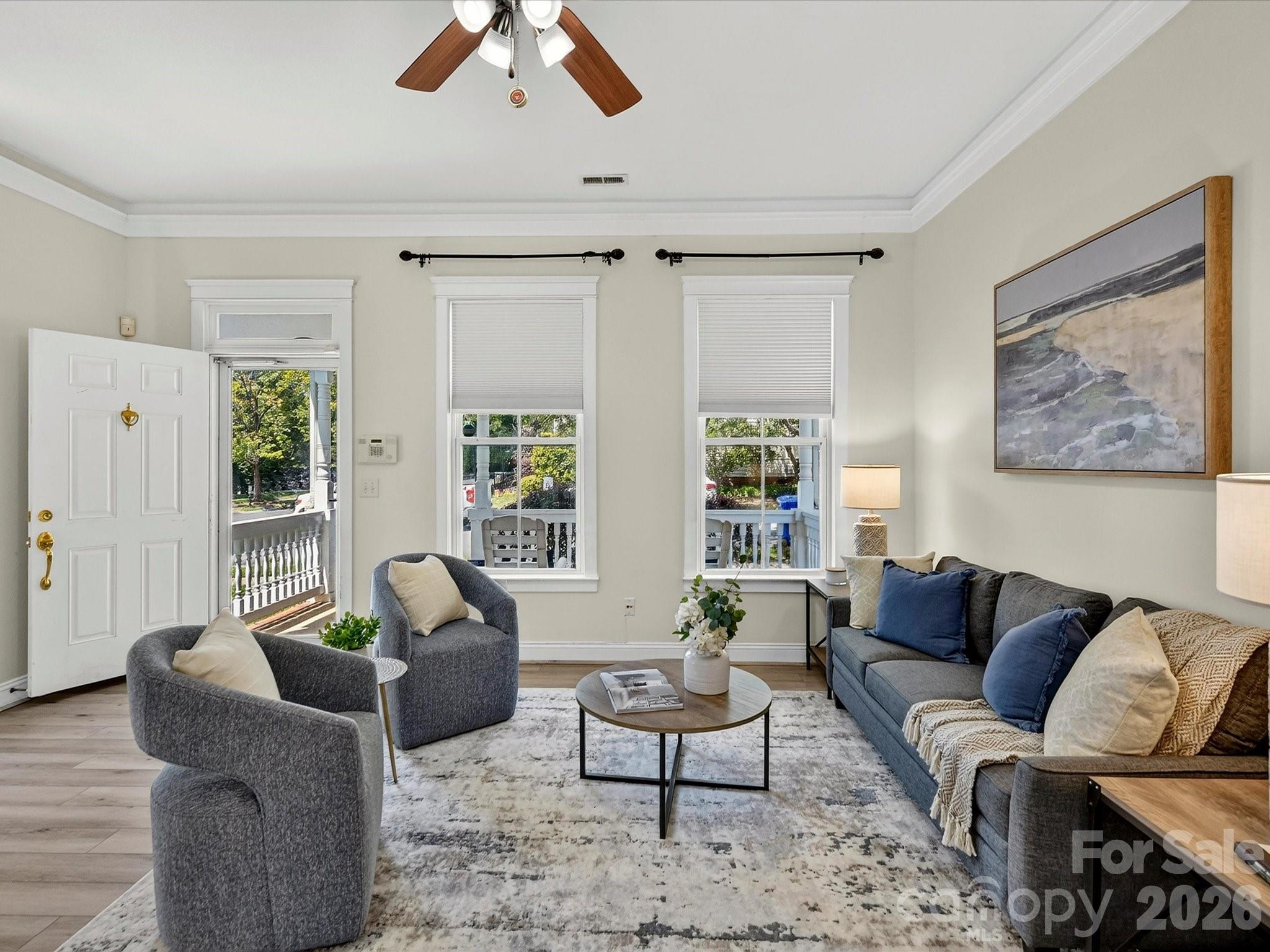 Designed for both comfort and functionality, the light-filled Great Room features a gas fireplace, crown molding, and an open layout that flows effortlessly into the home's gathering spaces. - 13106 Kennerly Drive, Huntersville
