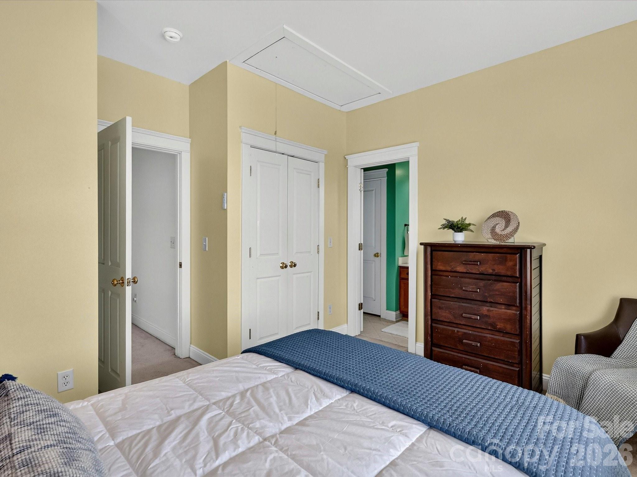 Bedroom 2 provides a comfortable retreat with a spacious closet, soft natural light, and direct access to the nearby full bath. - 13106 Kennerly Drive, Huntersville