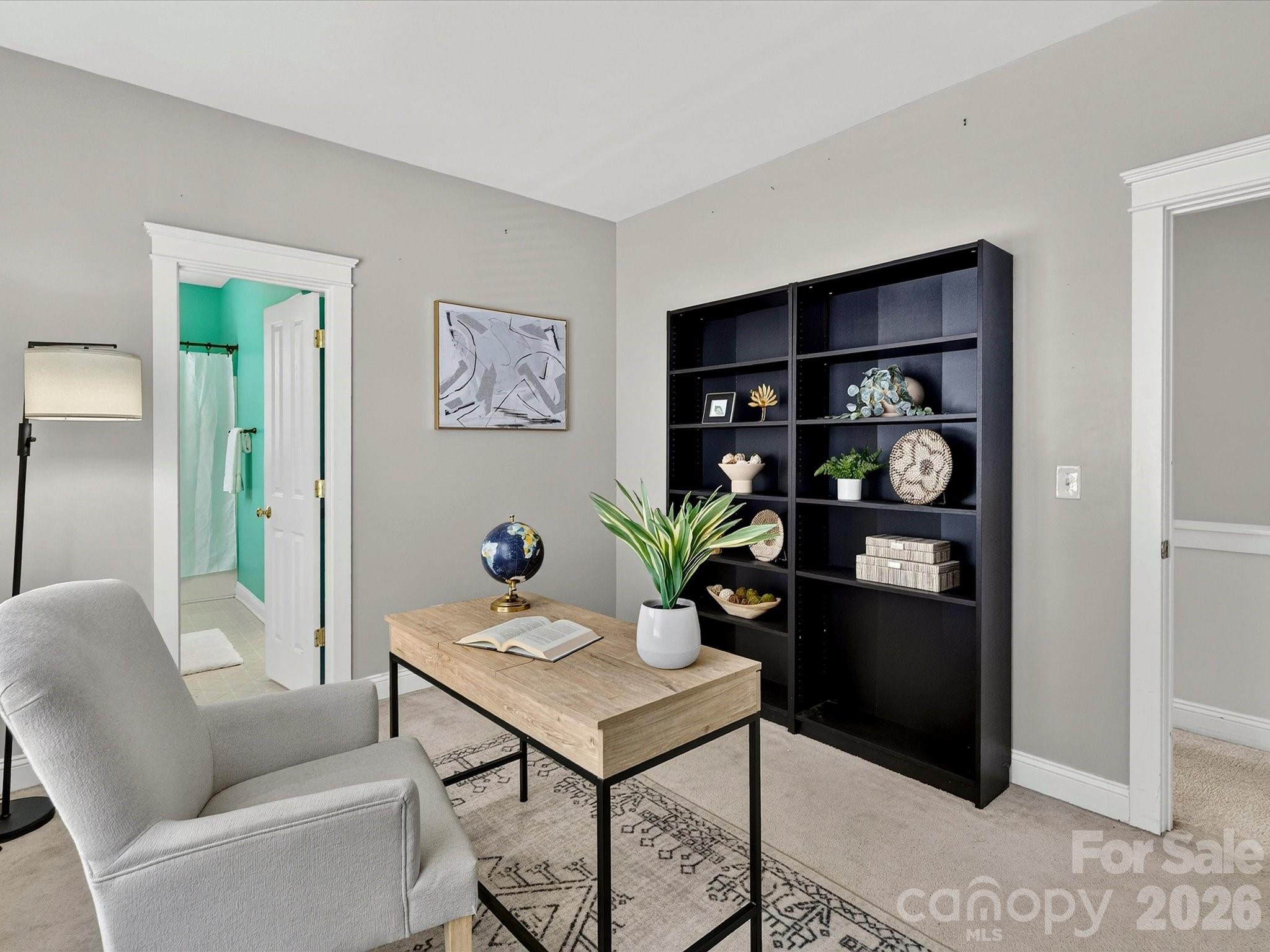 Bedroom 3 offers flexible living space ideal for guests, a home office, or hobbies, complete with generous natural light and convenient access to the adjacent full bath. - 13106 Kennerly Drive, Huntersville