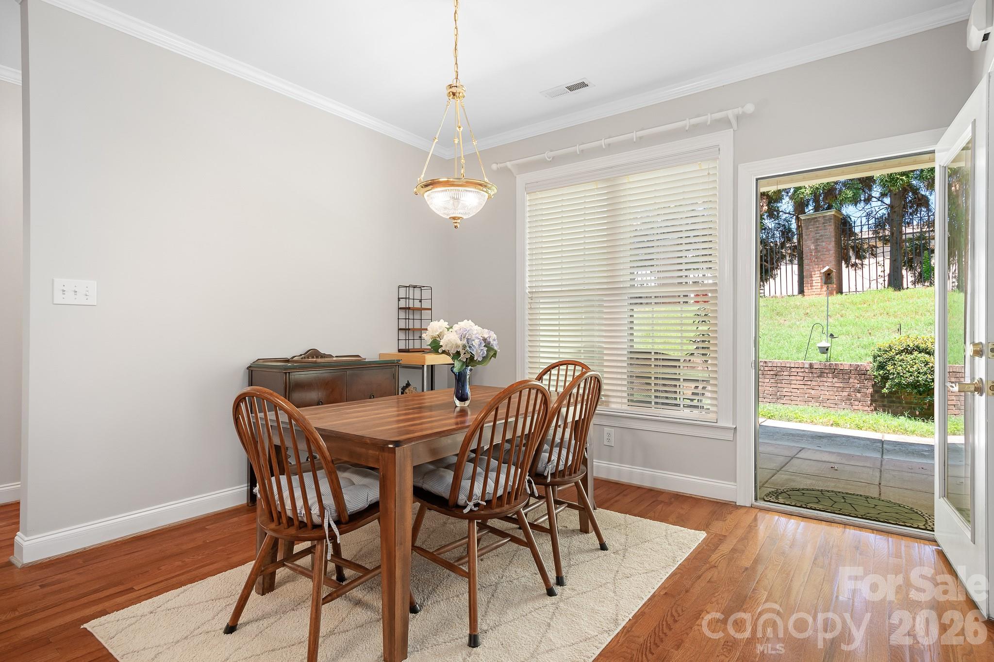 Dining area is open to kitchen and has a door leading to your back patio area - 215 Knops Nob Road, Mooresville