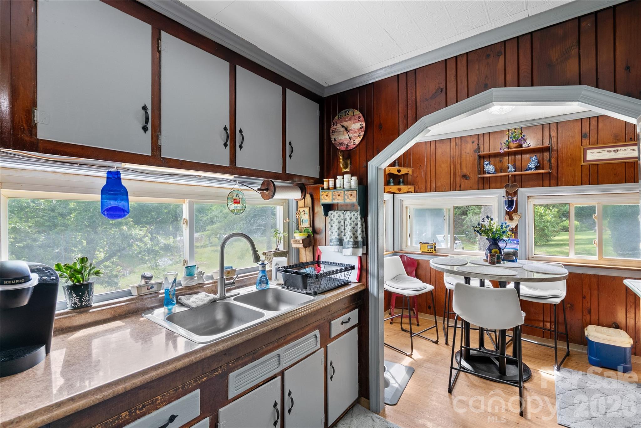 Kitchen looking into eat-in area w/windows - 3151 N Bearwallow Road, Hendersonville