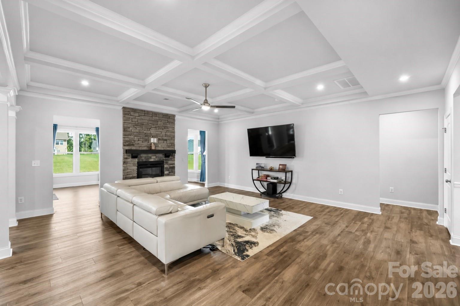 A space where everyday moments come together, framed by elegant coffered ceilings. - 1402 Ashe Meadow Drive, Indian Trail