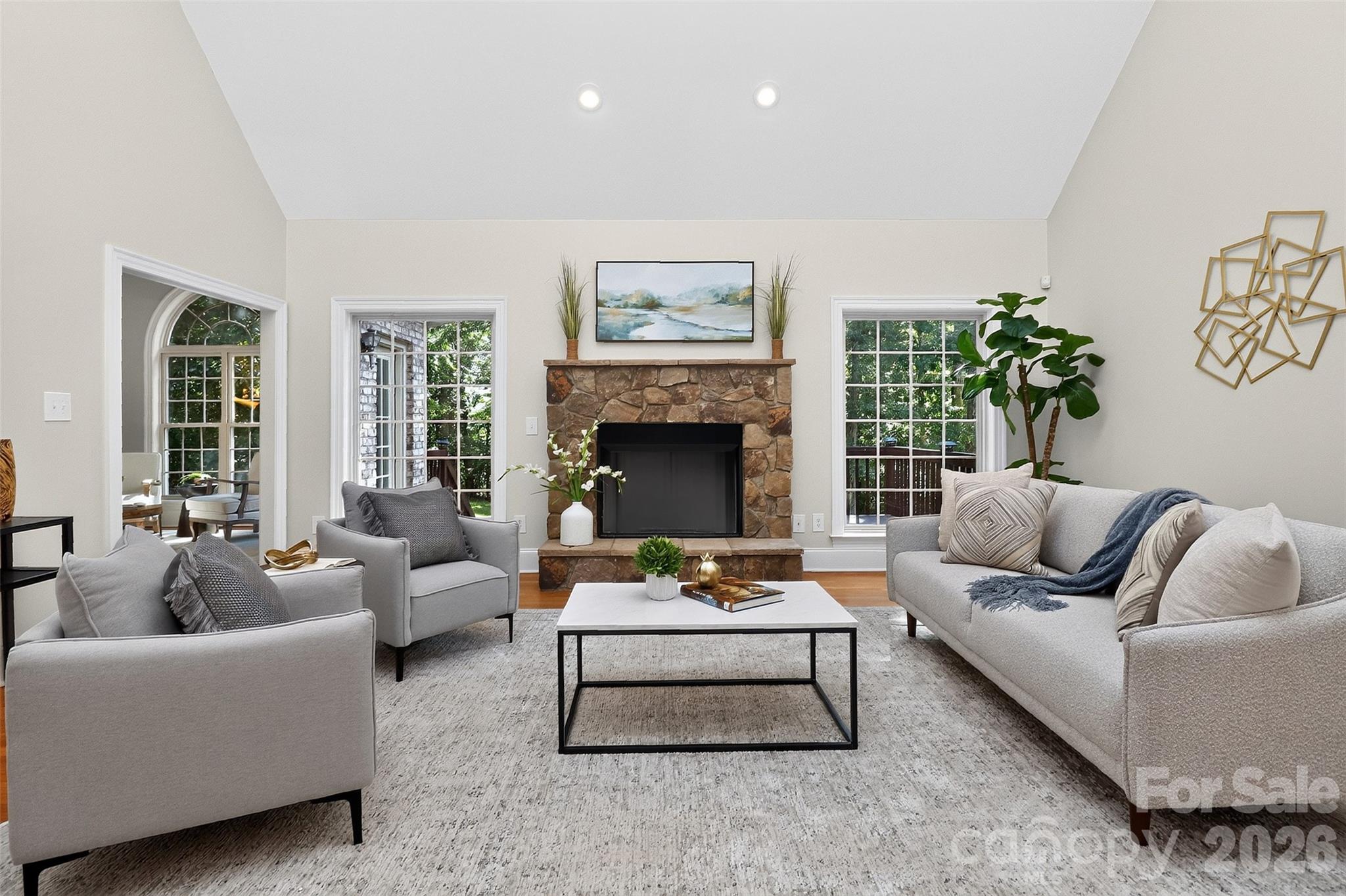 Living room with vaulted ceiling and gas fireplace. - 4817 Pimlico Lane, Waxhaw