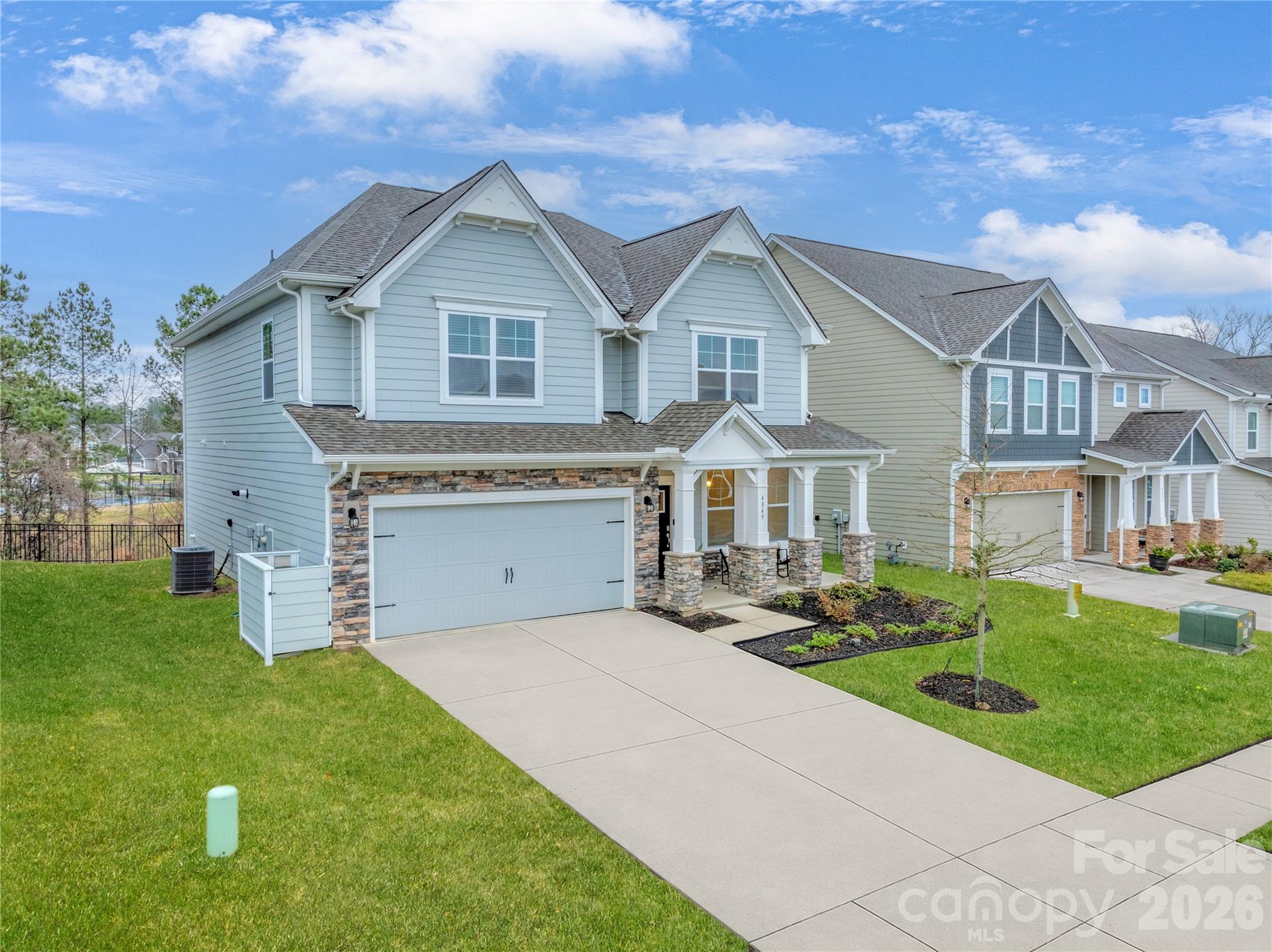 This home features craftsman inspired column and decorative trim accents and two car garage - 4849 Tacoma Drive, Fort Mill