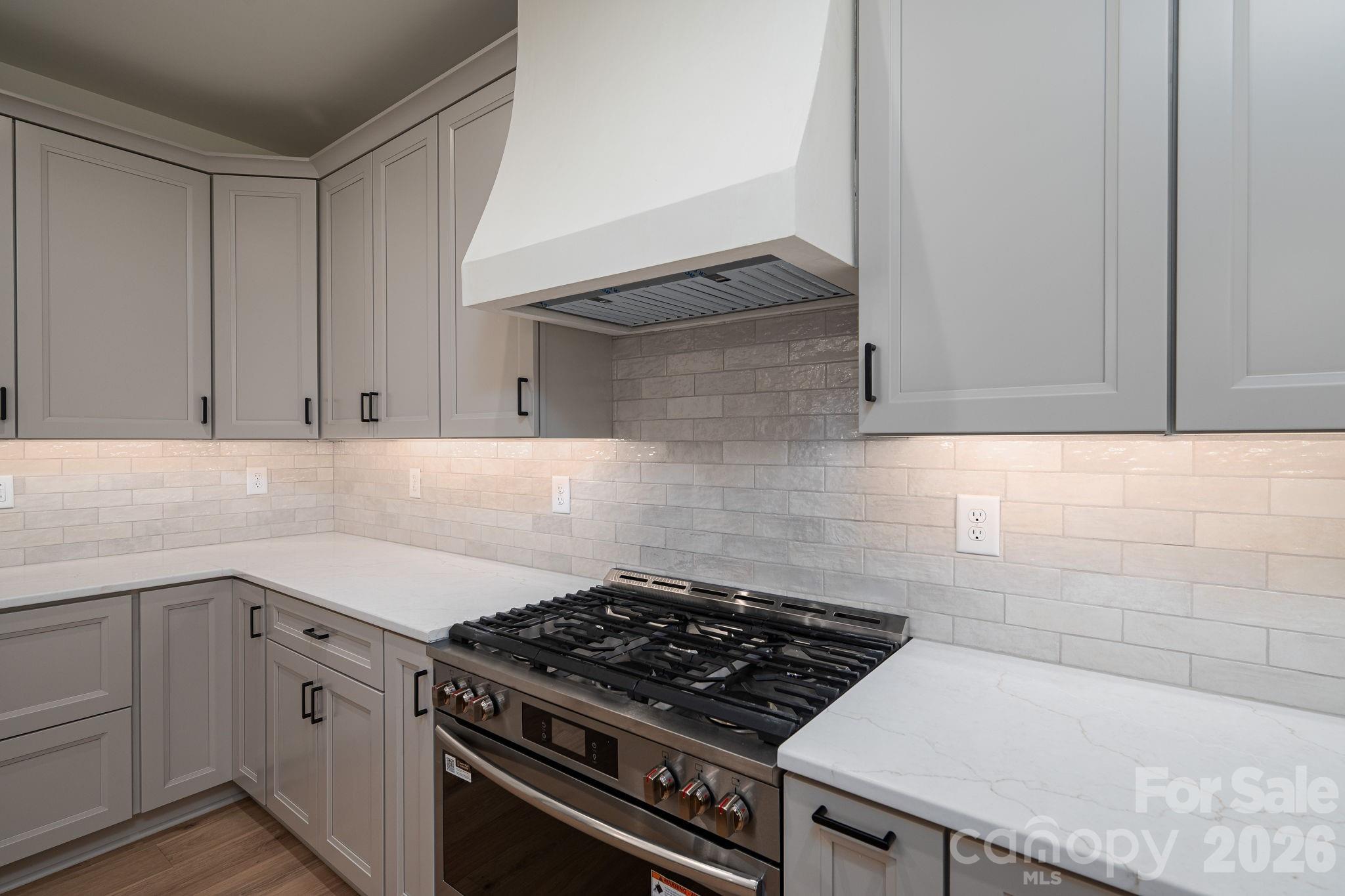 Stunning custom range hood with a 36" gas range - 526 N Aspen Street, Lincolnton