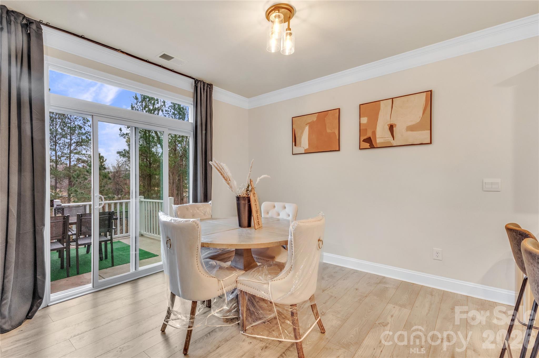 Perfect for morning coffee and casual meals, this bright and airy breakfast nook seamlessly bridges indoor living and outdoor relaxation - 4849 Tacoma Drive, Fort Mill