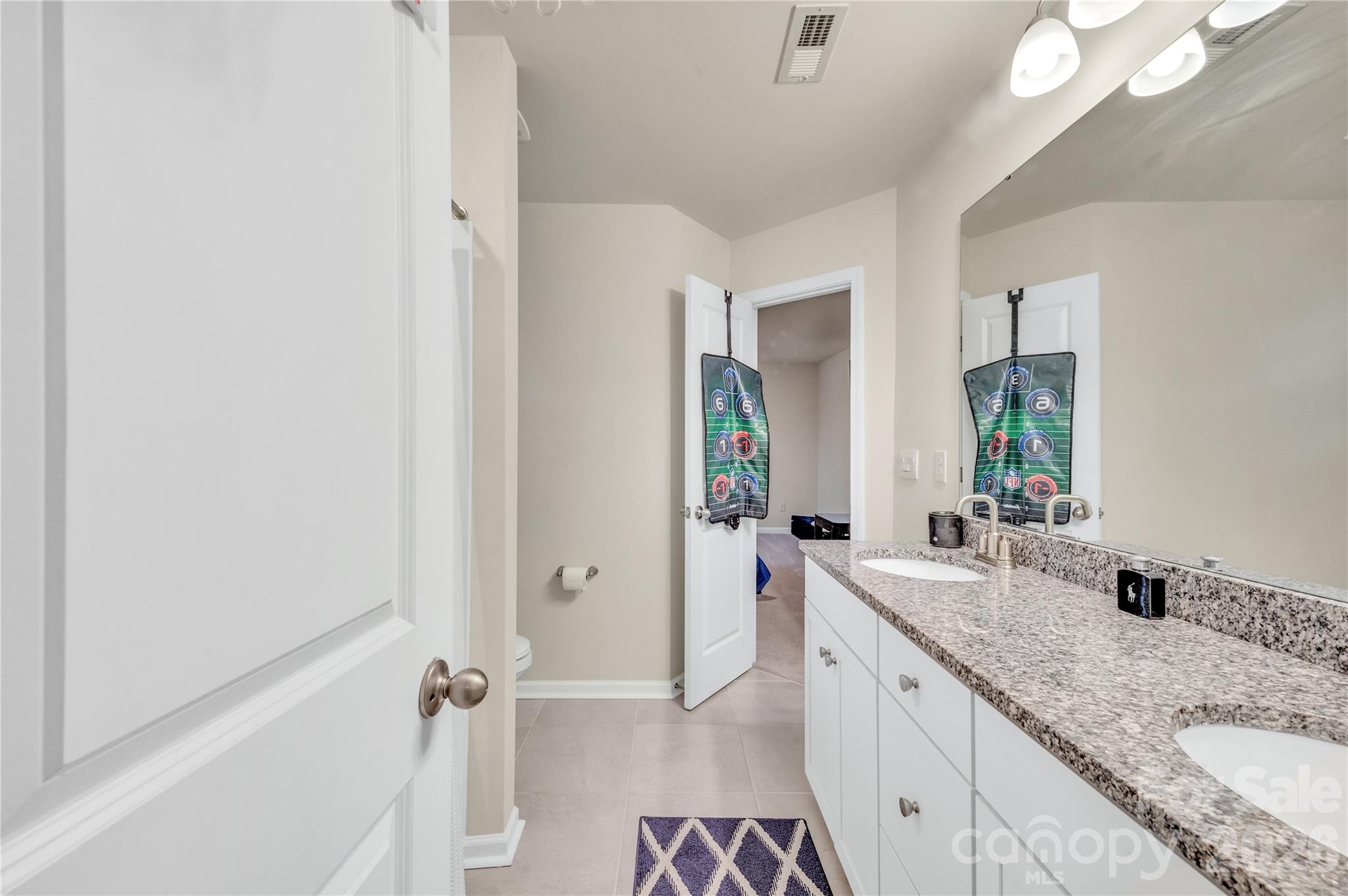 This space boast an expansive double-sink vanity with plenty of storage. - 4849 Tacoma Drive, Fort Mill