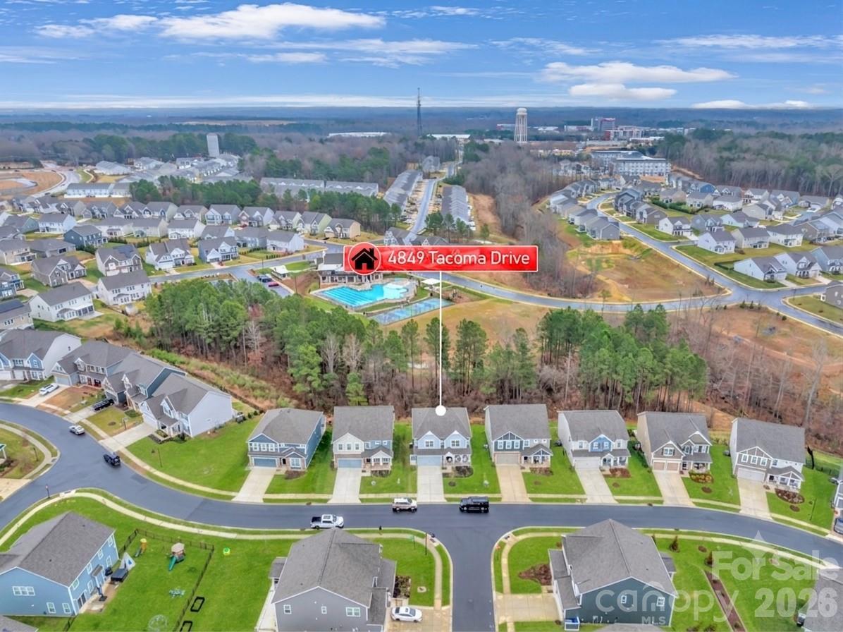 Open streetscape in front with clean sidewalks and beautiful tree-lined view in the back that enhances privacy. - 4849 Tacoma Drive, Fort Mill