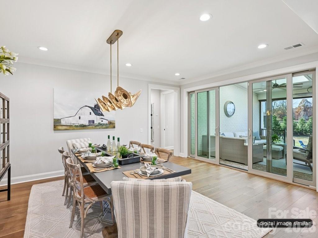 The Dining opens to the covered outdoor space with doors - 6535 Cashion Road, Huntersville