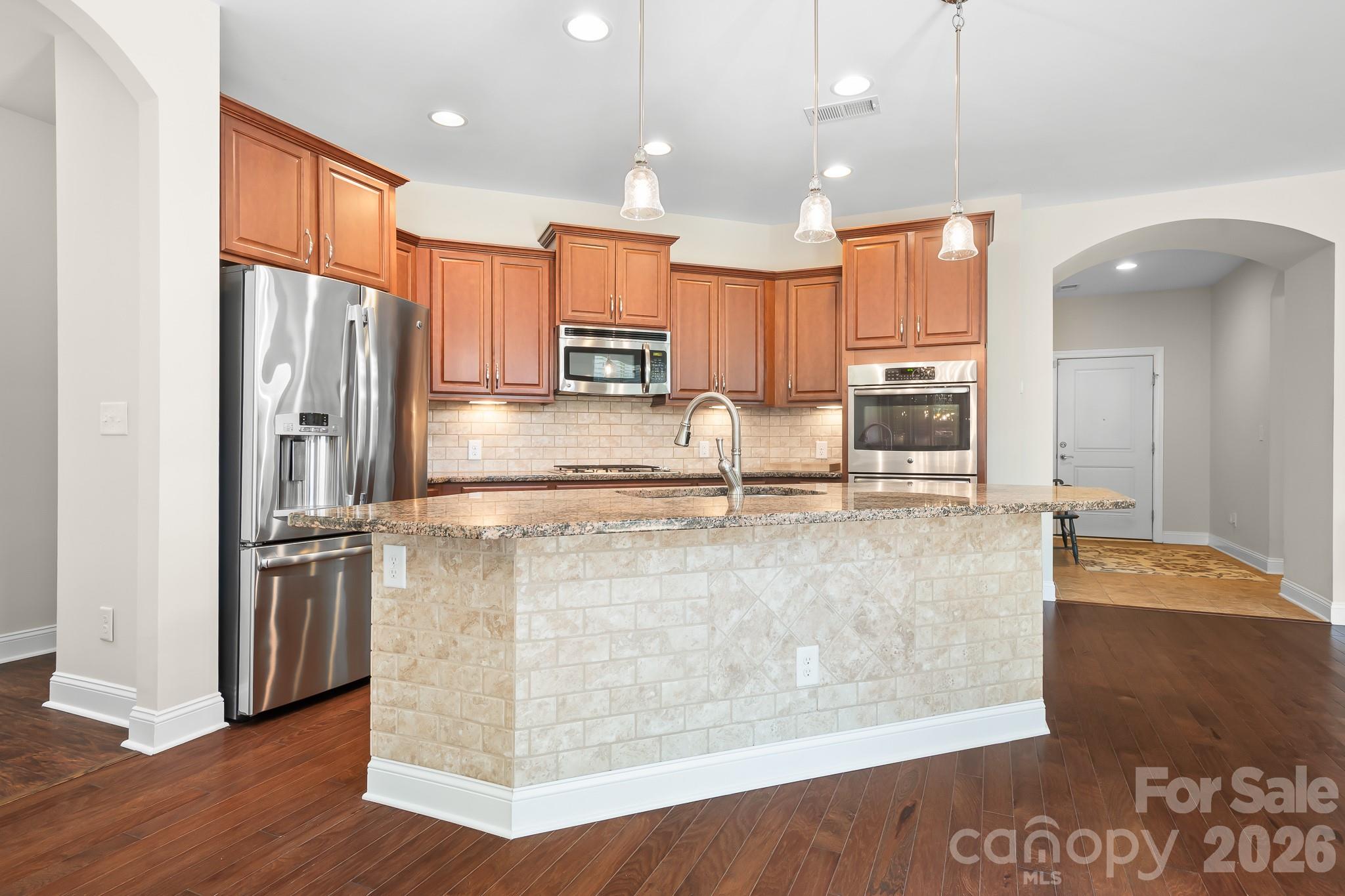 Nicely appointed kitchen with island and tons of cabinets! - 127 Brawley Point Circle, Mooresville