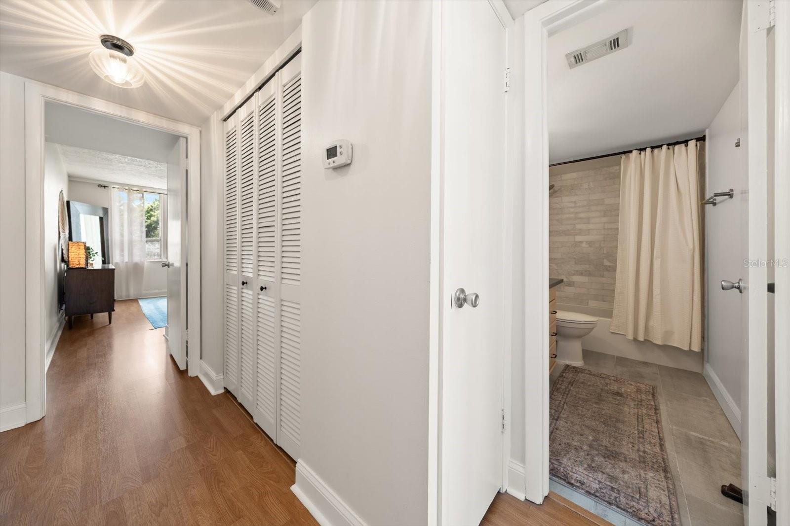 Hallway with linen closet outside of 2nd bath. - 2614 COVE CAY DR #409, CLEARWATER