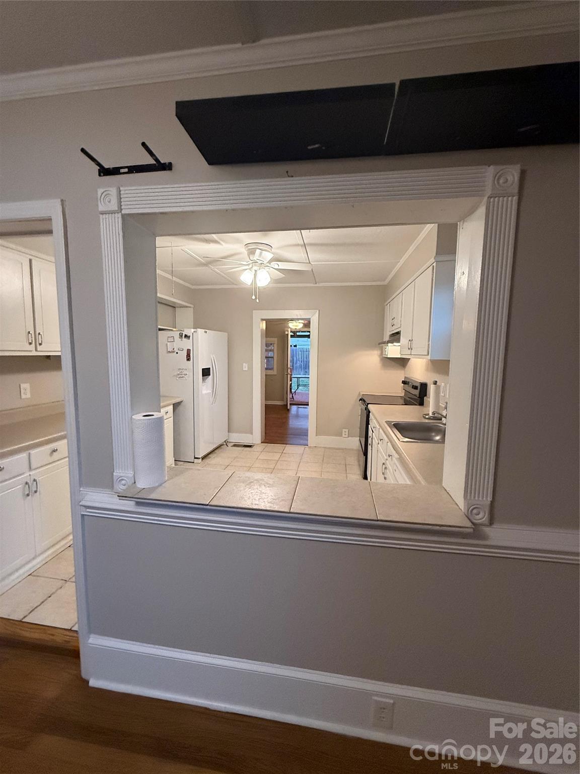 Pass-through into kitchen.View into kitchen - 4220 Harvard Avenue, Greensboro