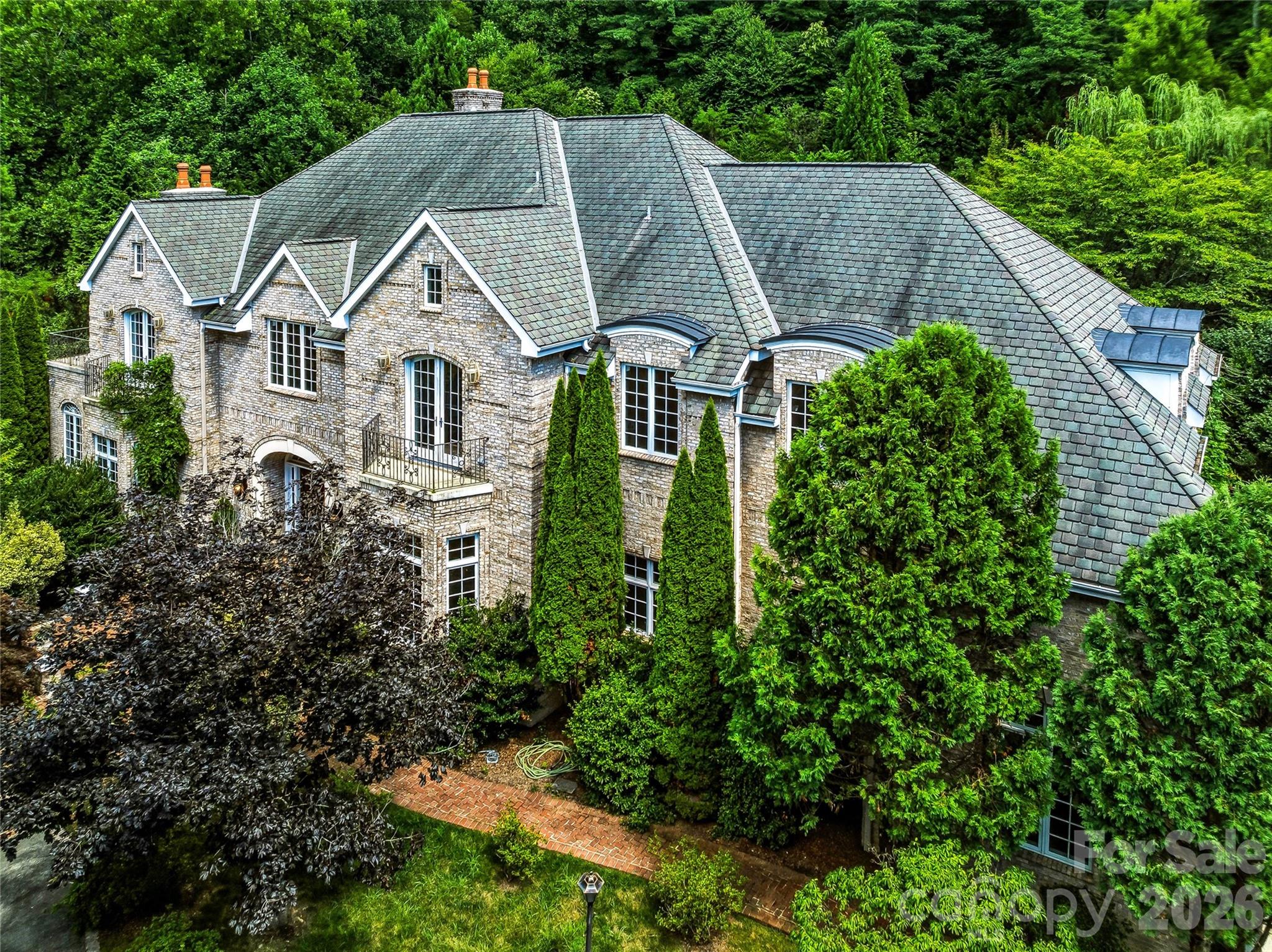 Ten acres of privacy. One extraordinary estate. The driveway is just the beginning. - 150 Rainbow View Drive, Fletcher