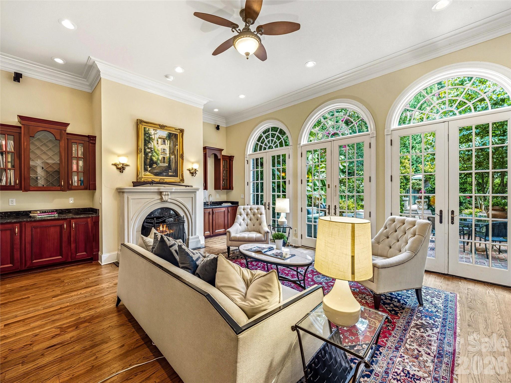 Great Room Fireplace. Wet bar. Custom built-ins. And doors that open to something even better. - 150 Rainbow View Drive, Fletcher