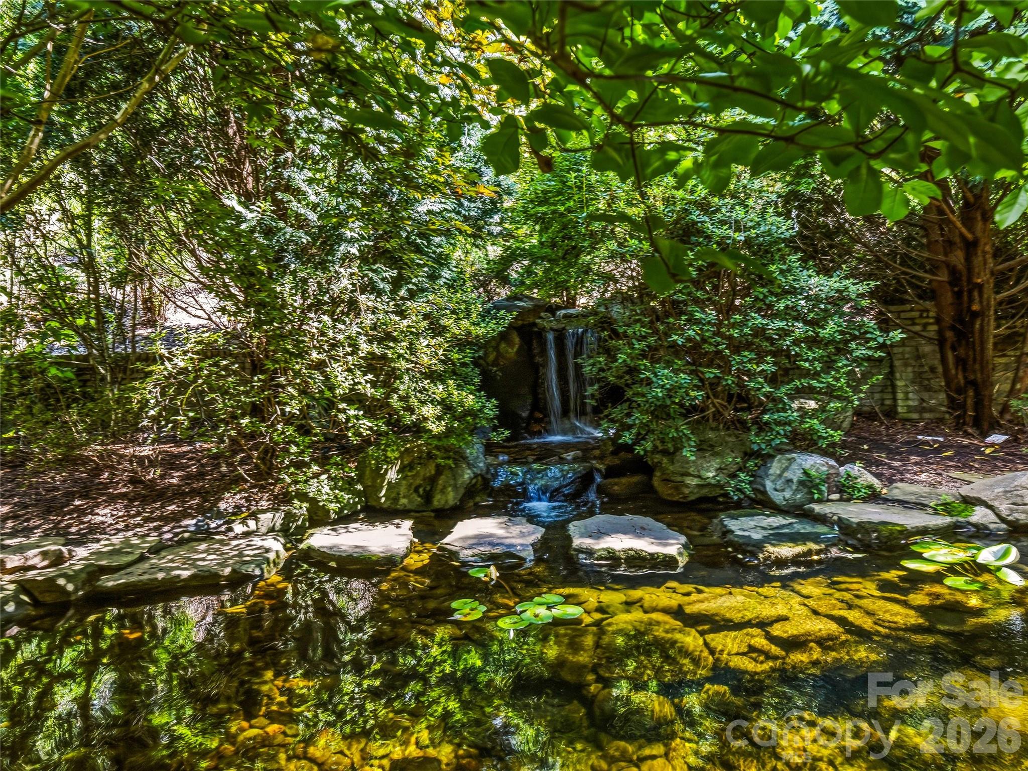 Fountain. Koi pond with waterfall. Resort living — without the checkout date. - 150 Rainbow View Drive, Fletcher