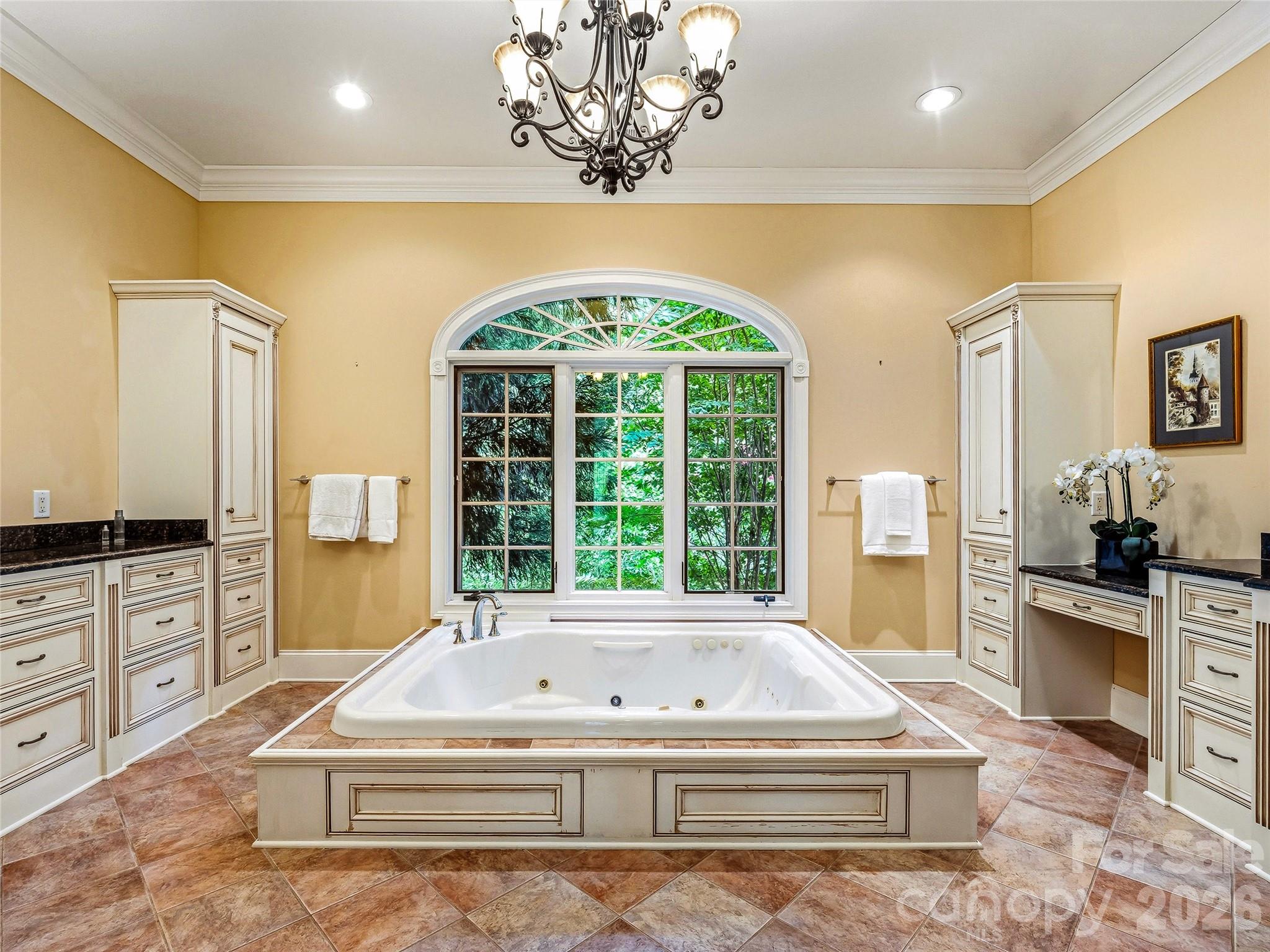 Primary Bath Heated tile floors. Jetted tub. Walk-in shower. Two closets. A spa that's exclusively yours. - 150 Rainbow View Drive, Fletcher