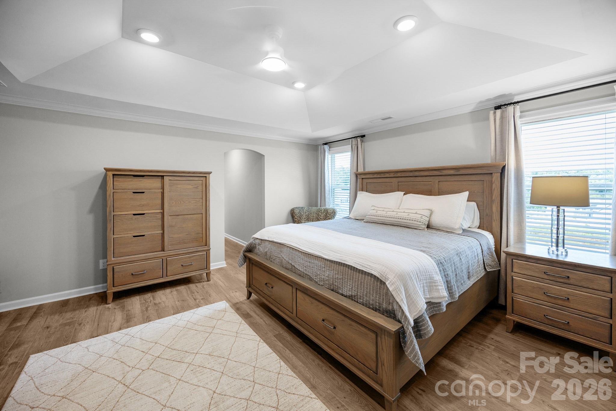 up the stairs and to the left, you will find the massive primary bedroom with its ensuite bathroom and extensive walk in closet - 5080 Mooreland Oaks Way, Mount Holly