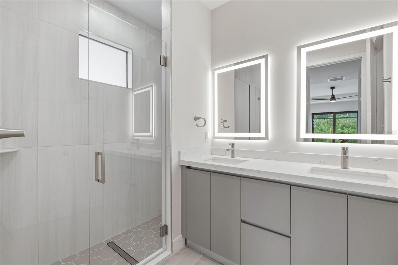 Primary Bathroom with Dual Vanity, LED Mirrors and Walk-In Glass Shower - 14319 ALLENSWORTH AVE, PORT CHARLOTTE
