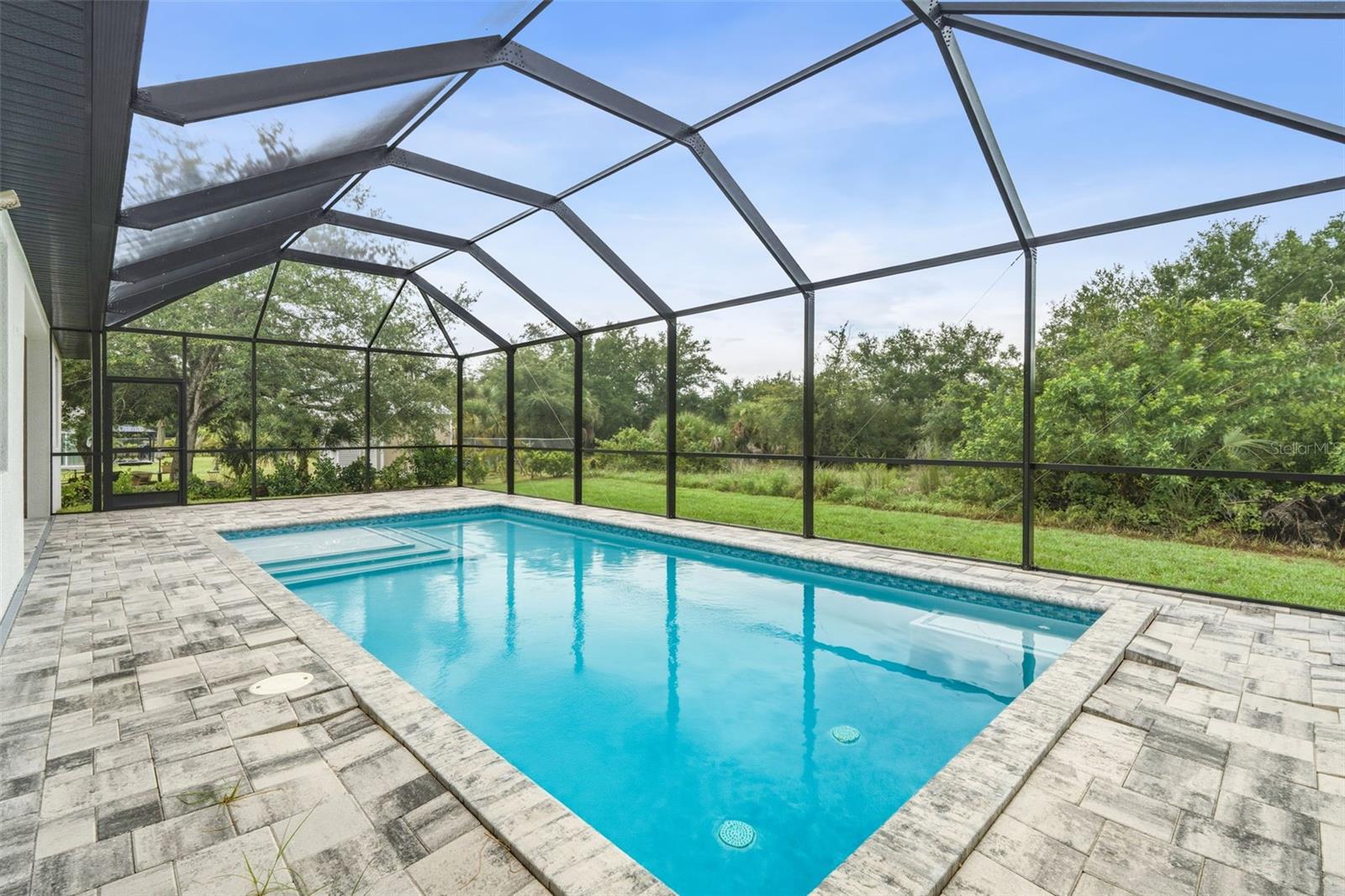 Screen Pool Area with Paver Deck and Peaceful Greenbelt Views - 14319 ALLENSWORTH AVE, PORT CHARLOTTE