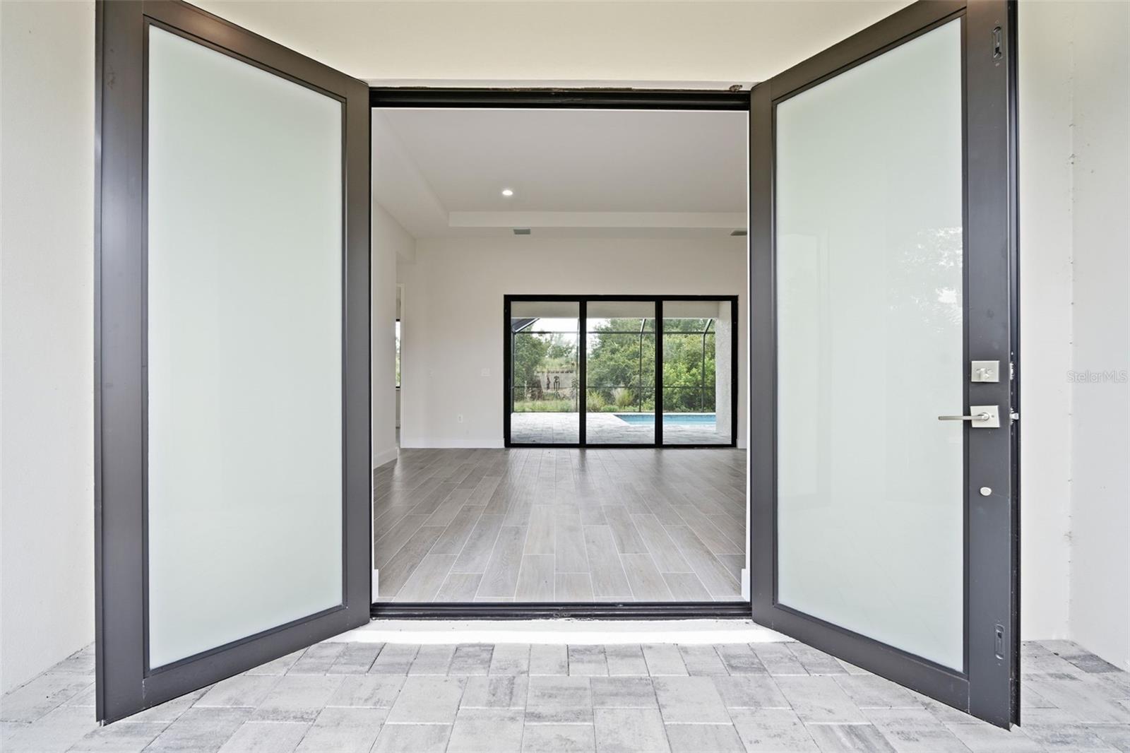 Double Frosted Entry Doors Welcome You Into the Home - 14319 ALLENSWORTH AVE, PORT CHARLOTTE