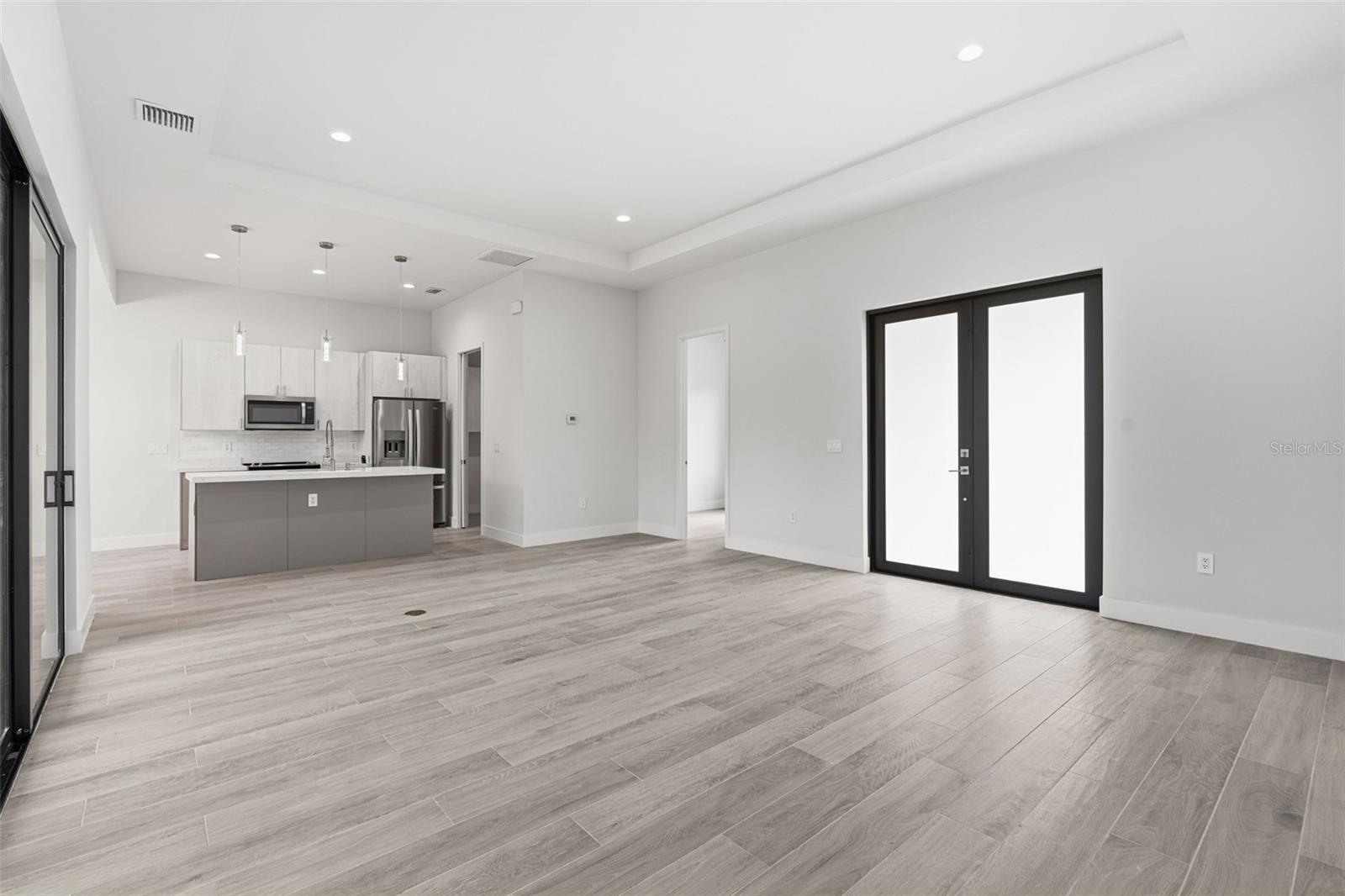 Spacious Living Area Showcasing 11ft Ceiling and Natural Light - 14319 ALLENSWORTH AVE, PORT CHARLOTTE