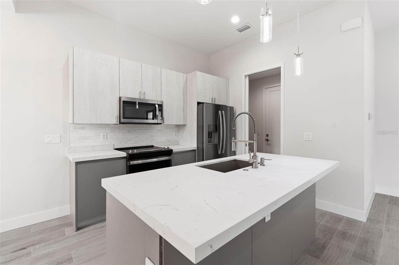 Kitchen Features Breakfast Bar and Stainless Appliances - 14319 ALLENSWORTH AVE, PORT CHARLOTTE