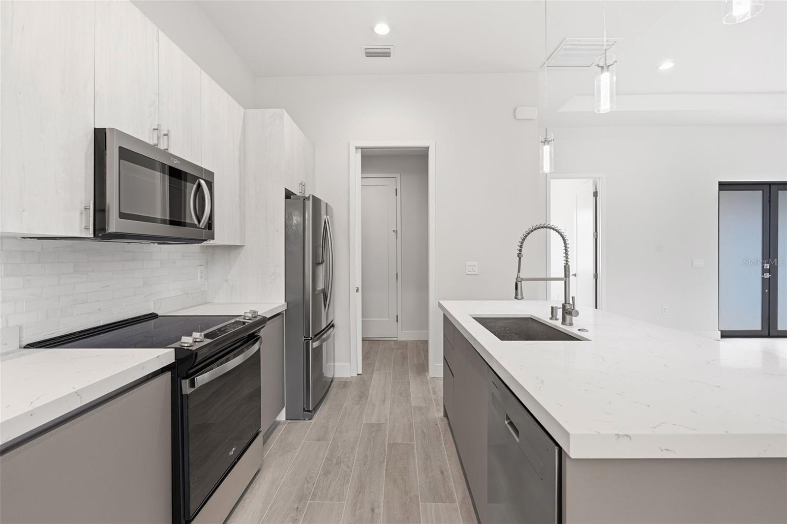Modern Chefs Kitchen with Quartz Counters and Stainless Steel Appliances - 14319 ALLENSWORTH AVE, PORT CHARLOTTE