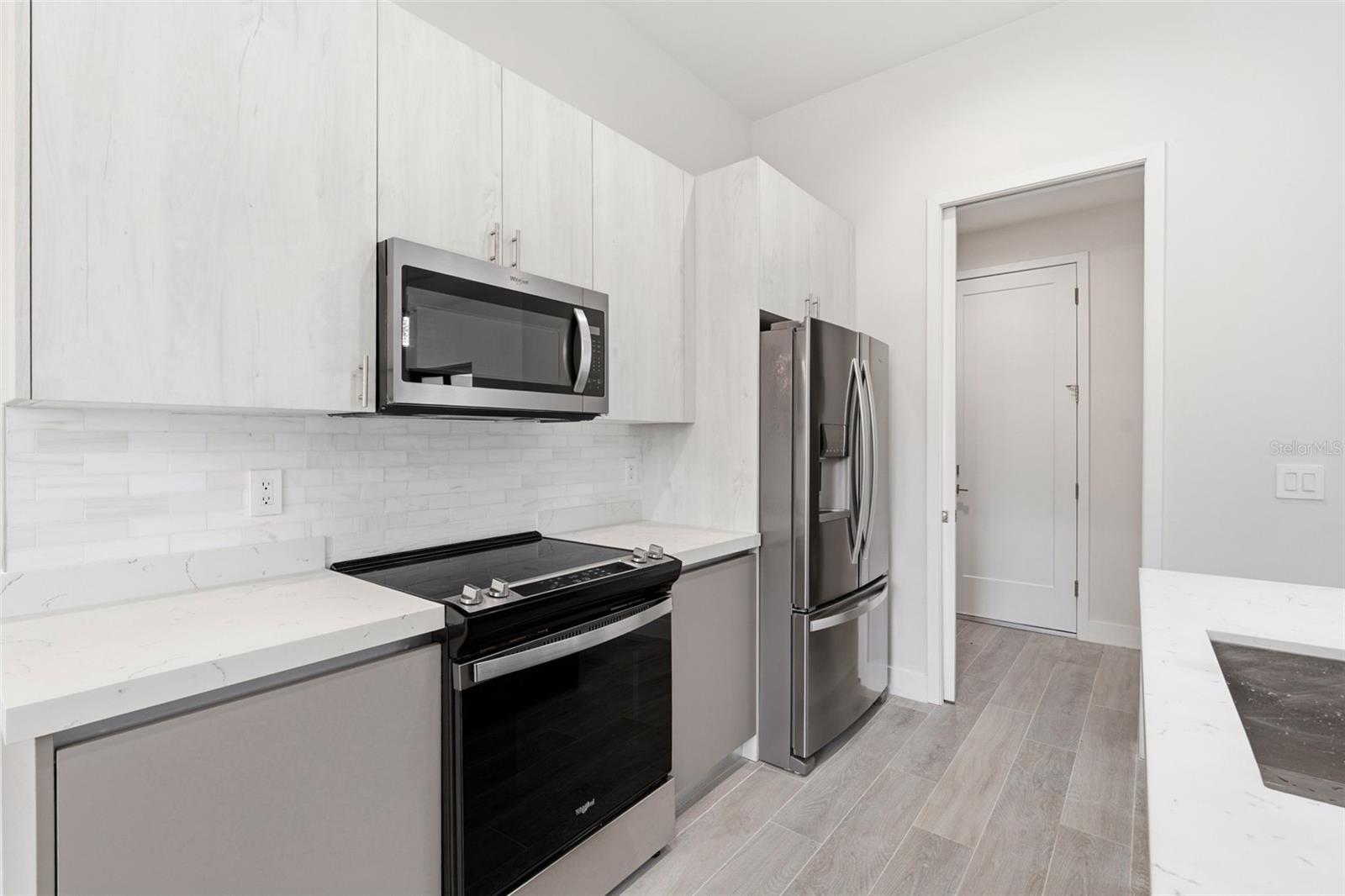 Beautiful Kitchen with European Inspired Cabinetry and Quartz Counters - 14319 ALLENSWORTH AVE, PORT CHARLOTTE