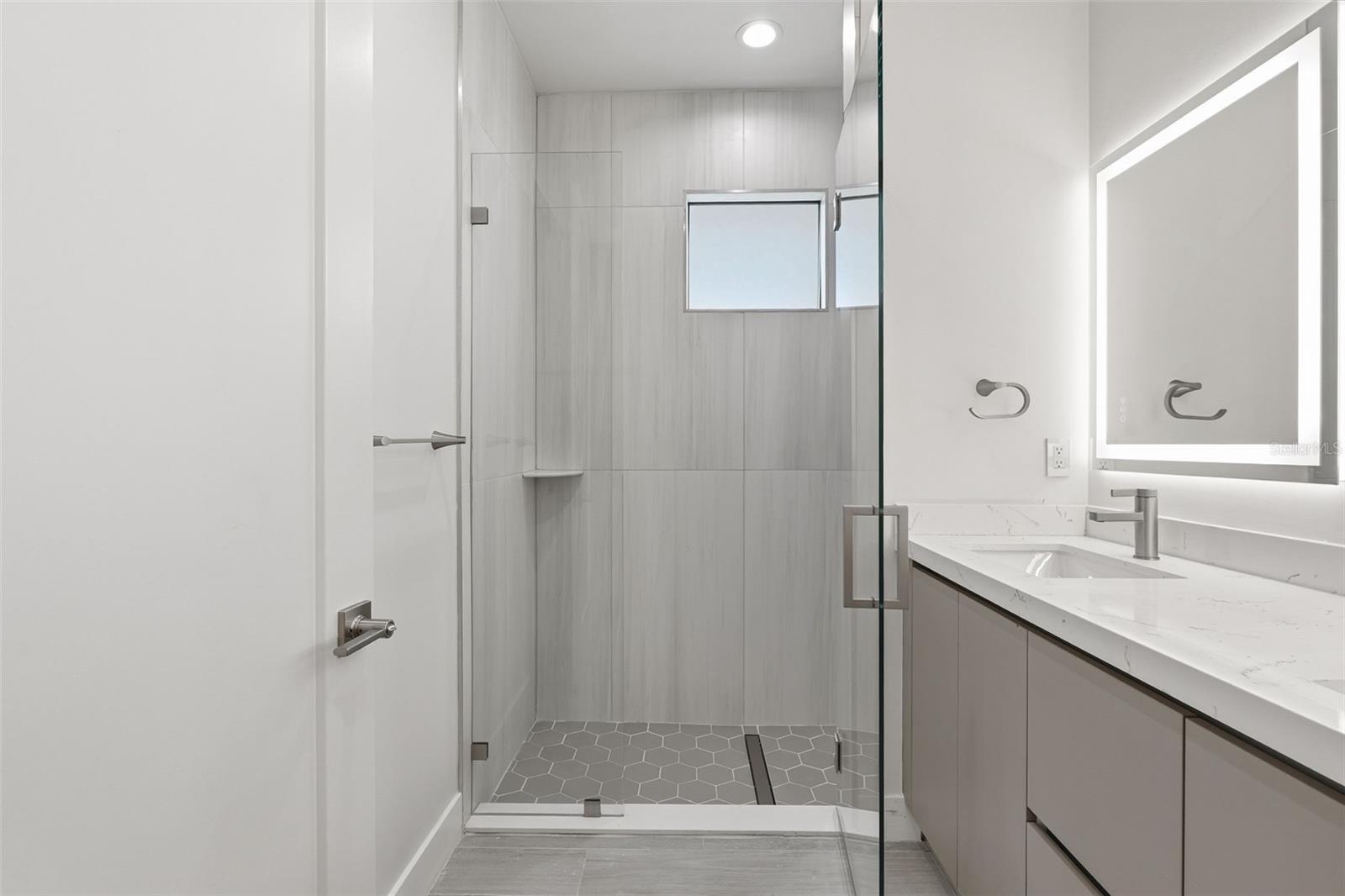 Primary Bathroom with Dual Vanity, LED Mirrors and Walk-In Glass Shower - 14319 ALLENSWORTH AVE, PORT CHARLOTTE
