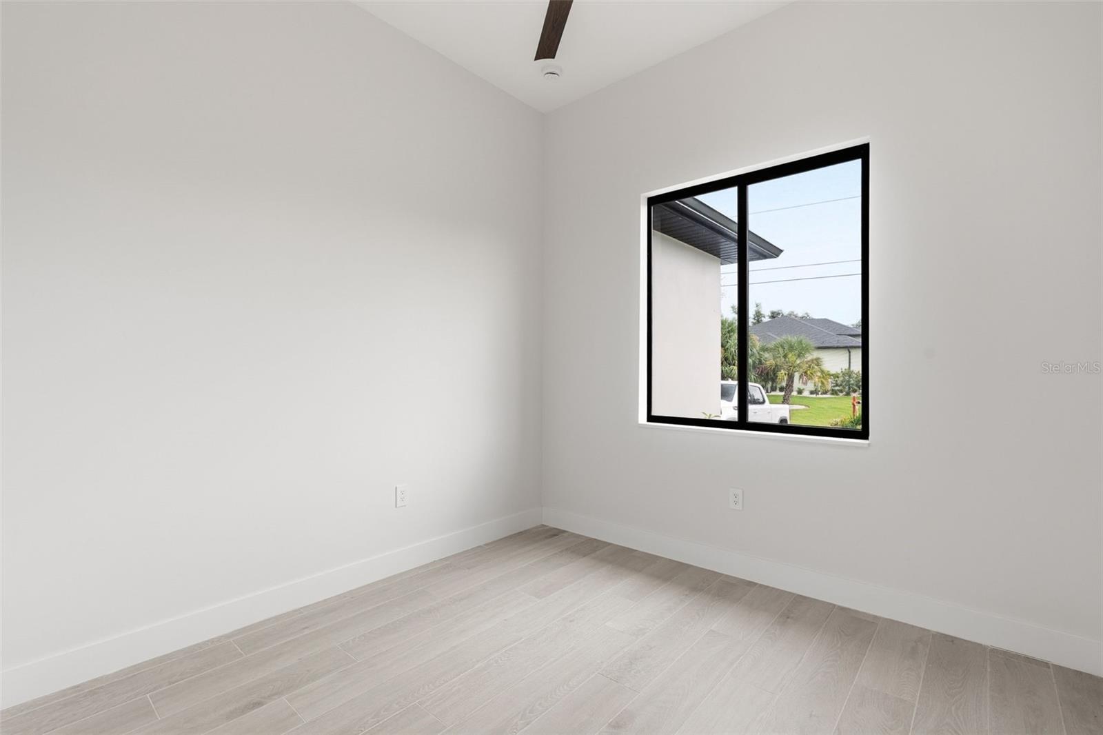 Bedroom 2 Features Natural Light and Modern Finishes - 14319 ALLENSWORTH AVE, PORT CHARLOTTE