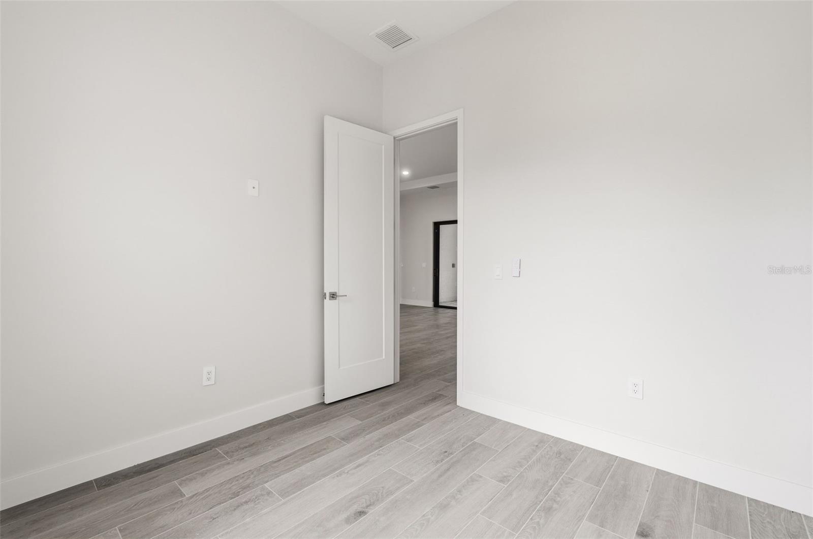Bedroom 2 Features Natural Light and Modern Finishes - 14319 ALLENSWORTH AVE, PORT CHARLOTTE