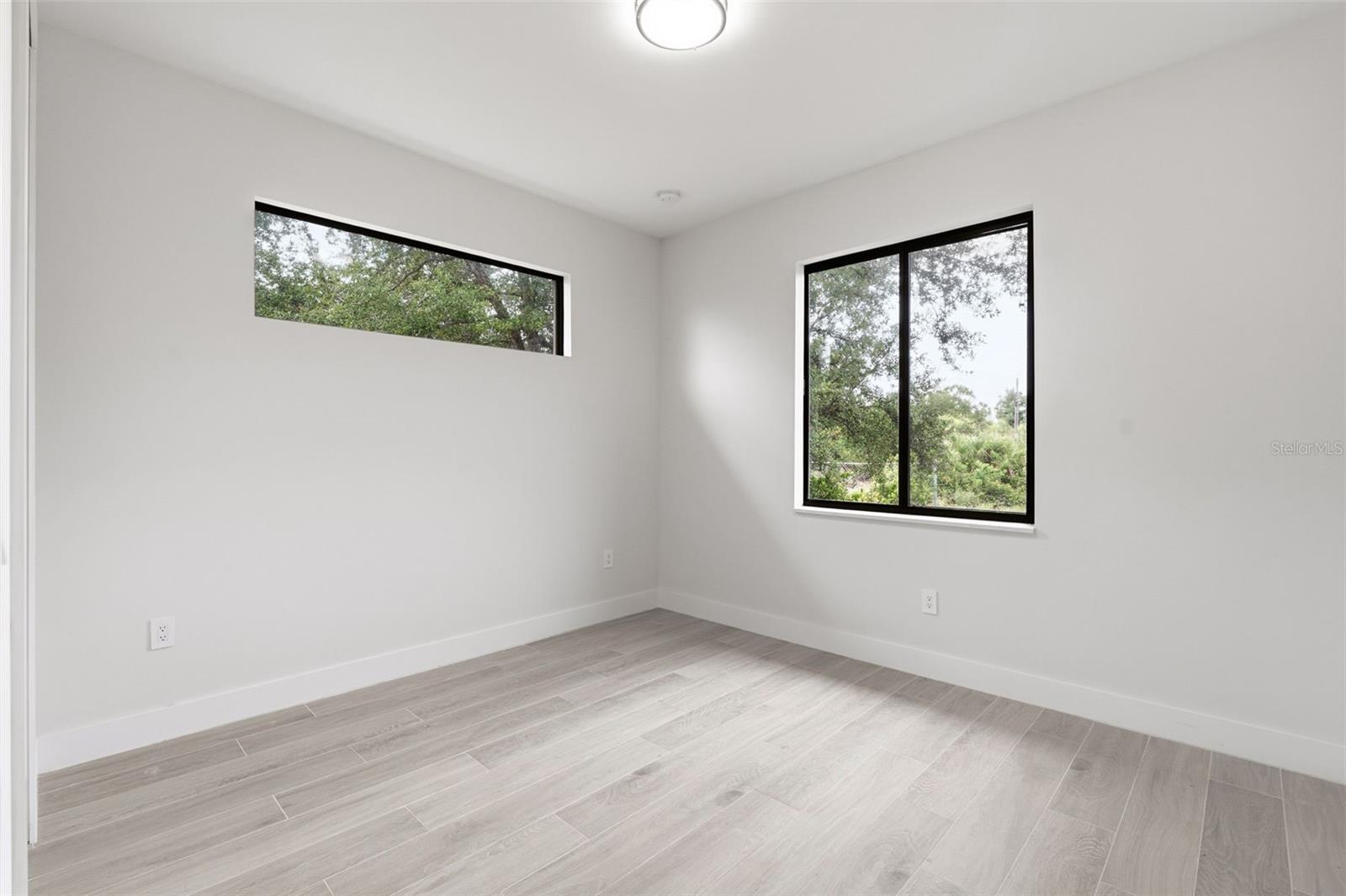 Bedroom 3 Features Porcelain Plank Tile Flooring & Clerestory Window - 14319 ALLENSWORTH AVE, PORT CHARLOTTE