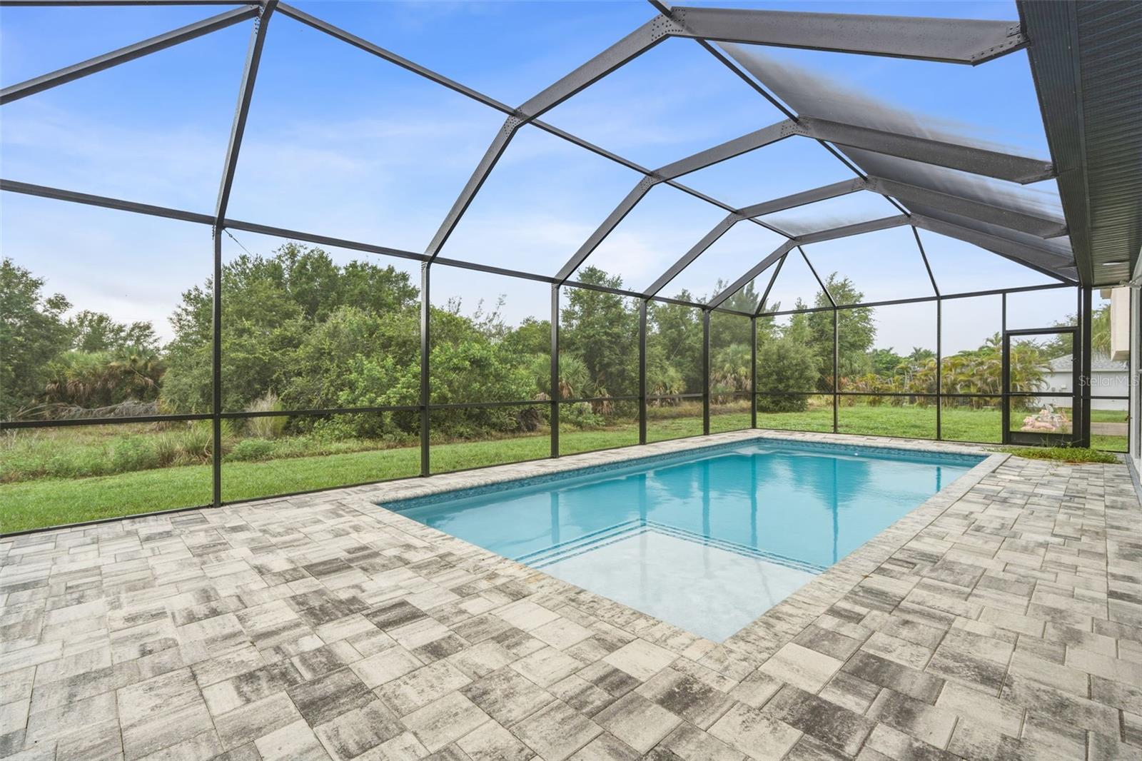 Screen Pool Area with Paver Deck and Peaceful Greenbelt Views - 14319 ALLENSWORTH AVE, PORT CHARLOTTE