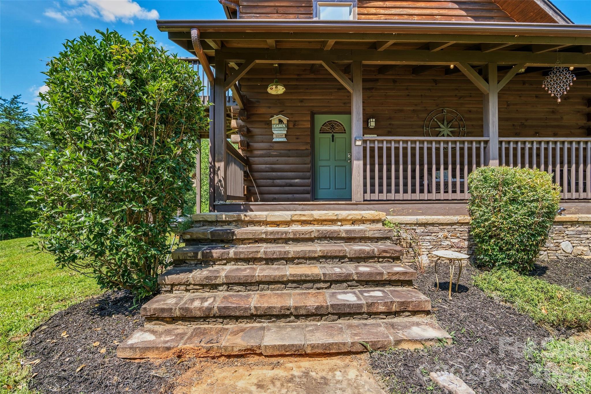 Beautiful rockwork on steps, foundation and entrance walkway - 4551 Lake Adger Parkway, Mill Spring