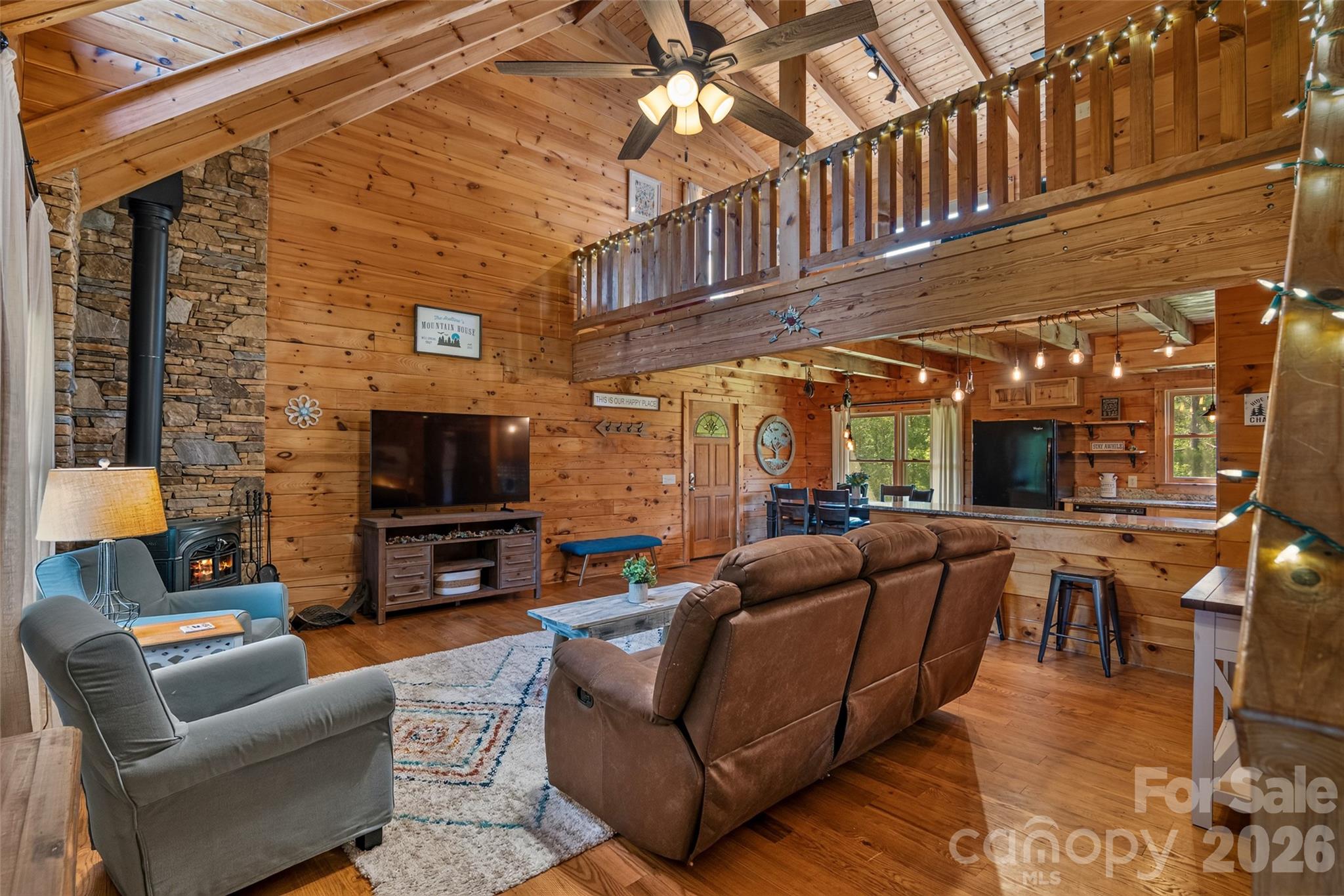 View from front entry showing stunning cathedral ceiling and view of open loft area above. - 4551 Lake Adger Parkway, Mill Spring