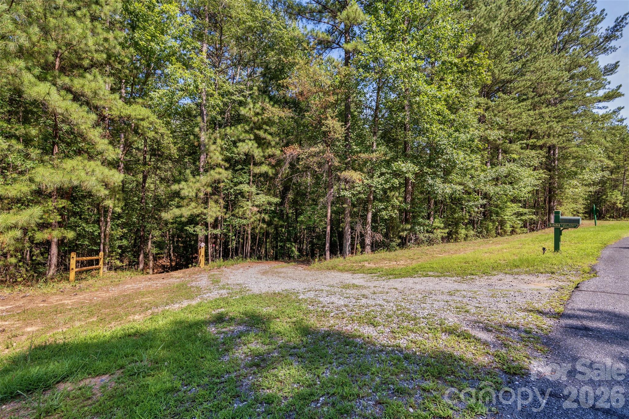 Drive in from Lake Adger Parkway. Driveway on right, Trail system on left. - 4551 Lake Adger Parkway, Mill Spring