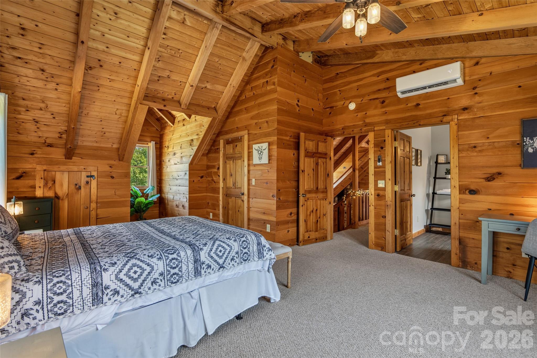 View 2 of primary bedroom with en-suite bath on right - 4551 Lake Adger Parkway, Mill Spring