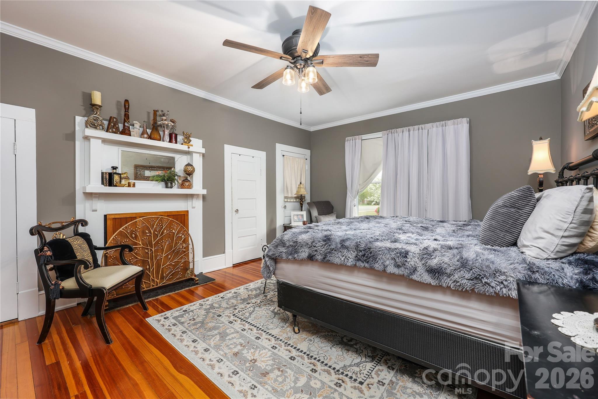 Primary bedroom with hardwood floors - 271 N Main Street, Denton