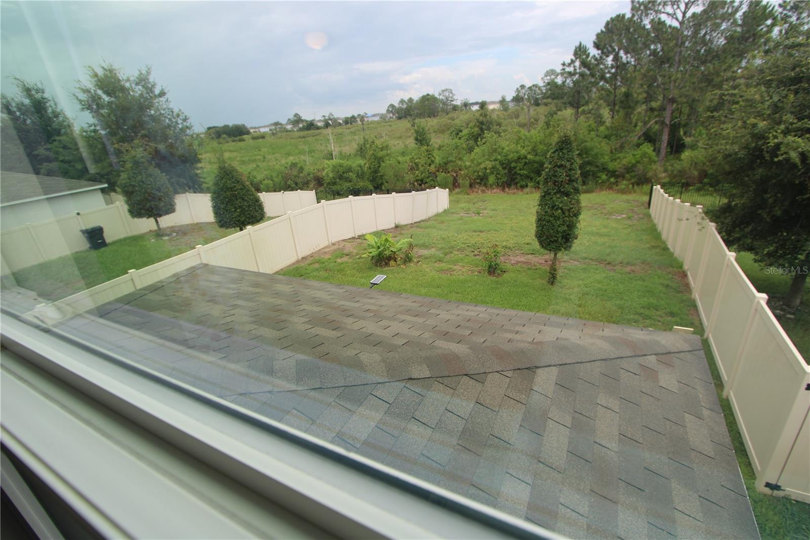 Peaceful views from the primary suite overlooking the backyard - 366 PRESERVE POINTE BLVD, DAVENPORT