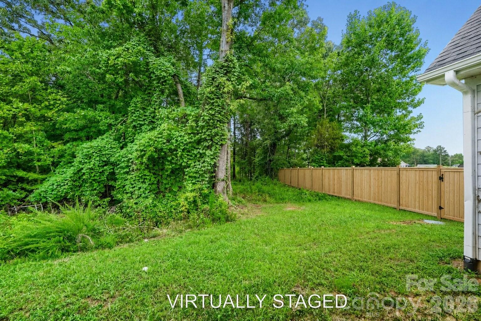 VIRTUALLY STAGED ADDED FENCE FOR EXAMPLE - 2358 Fay Jones Road, Denver