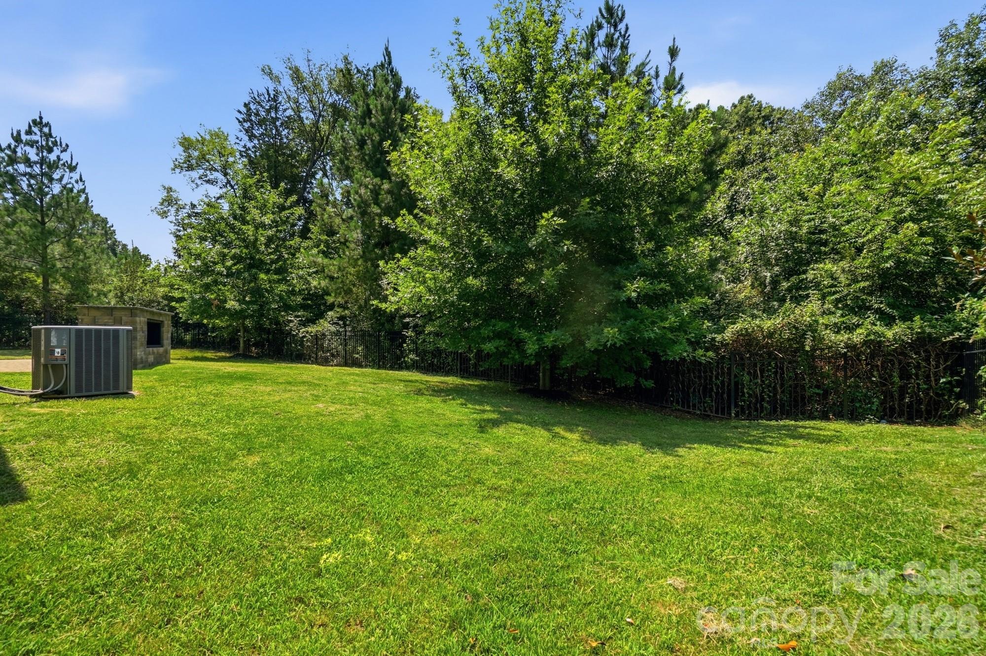 Private backyard with patio and buil-in grill - 9815 Caledenia Drive, Huntersville