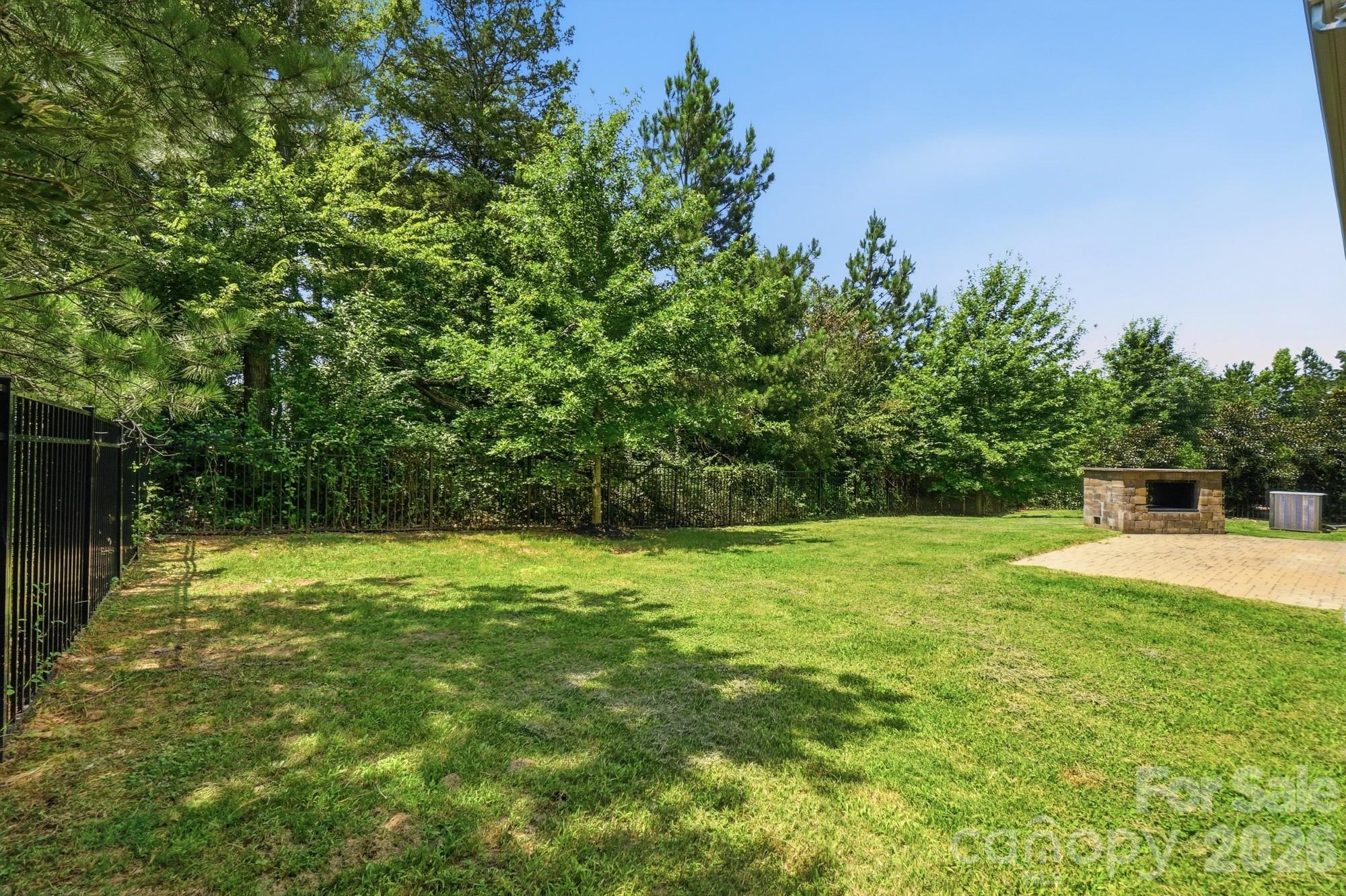 Private backyard with patio and buil-in grill - 9815 Caledenia Drive, Huntersville