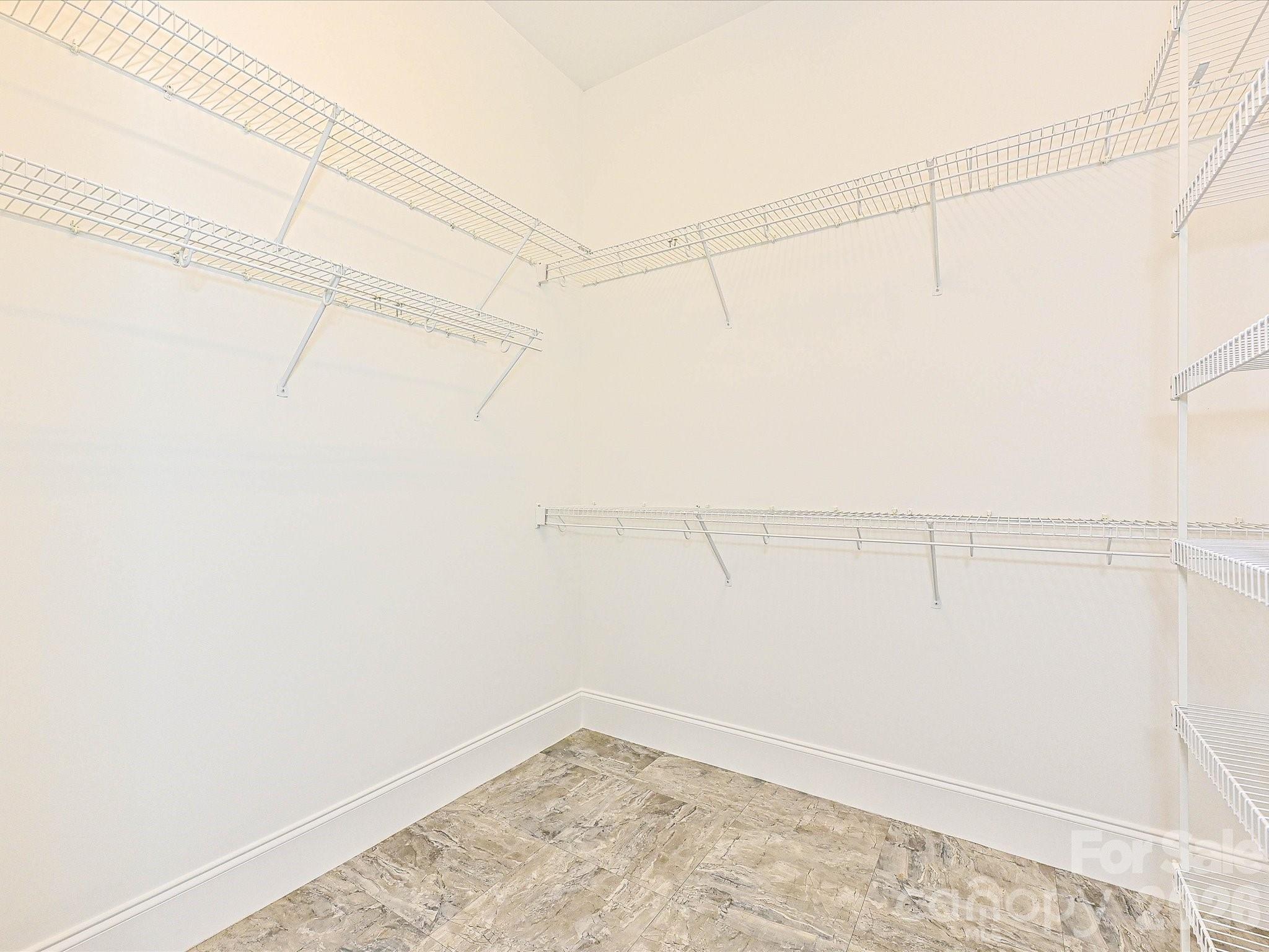 Primary walk-in closet - 2354 Perry Road, Denver
