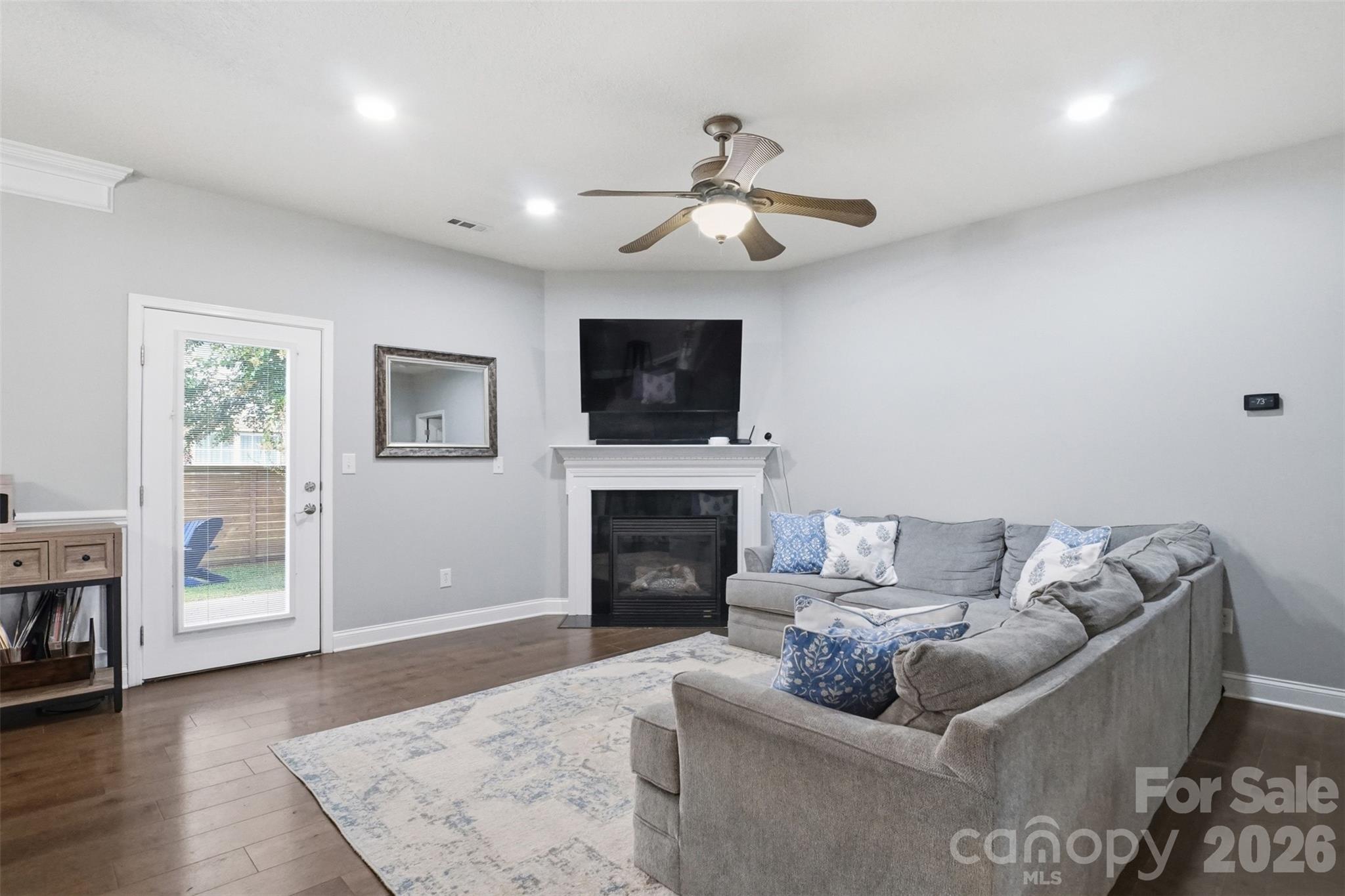 Open concept living room with gas fireplace for chilly nights or just a little ambiance! - 835 Estuary Court, Rock Hill
