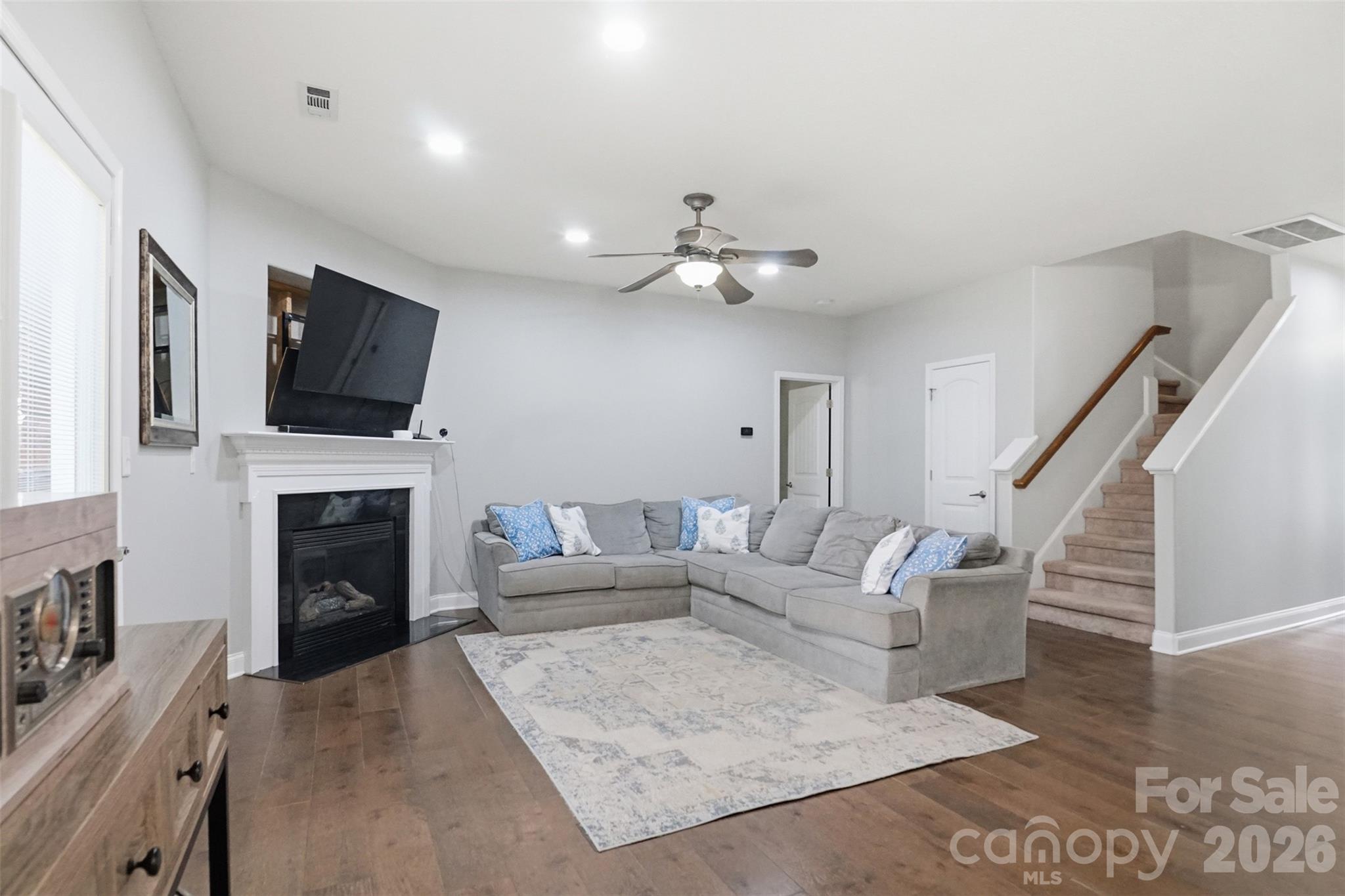 Dining area opens into the living room, and great storage in the closet below the stairs - 835 Estuary Court, Rock Hill