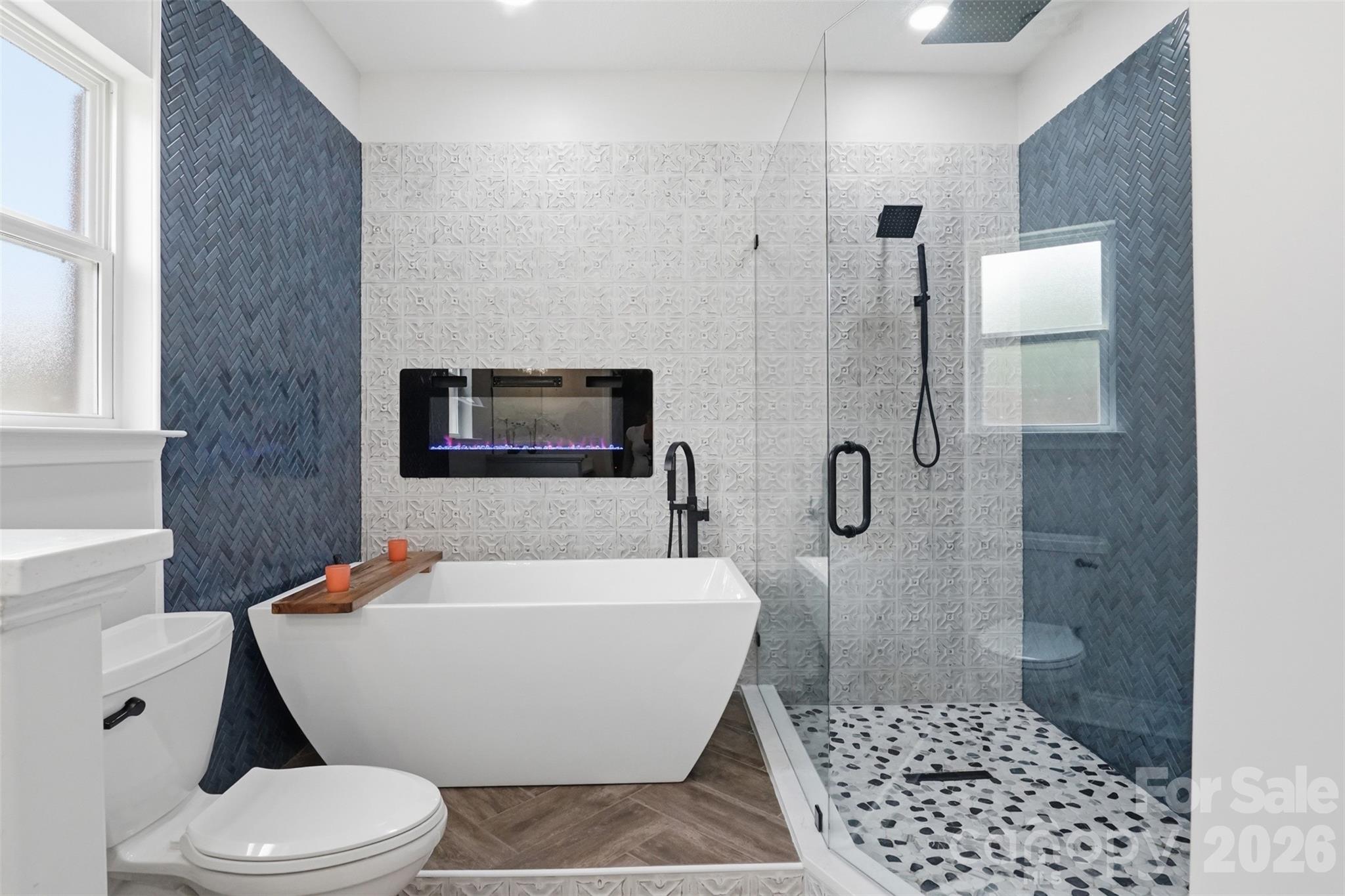 Tiled walls and frameless glass enclosure in updated shower! - 835 Estuary Court, Rock Hill