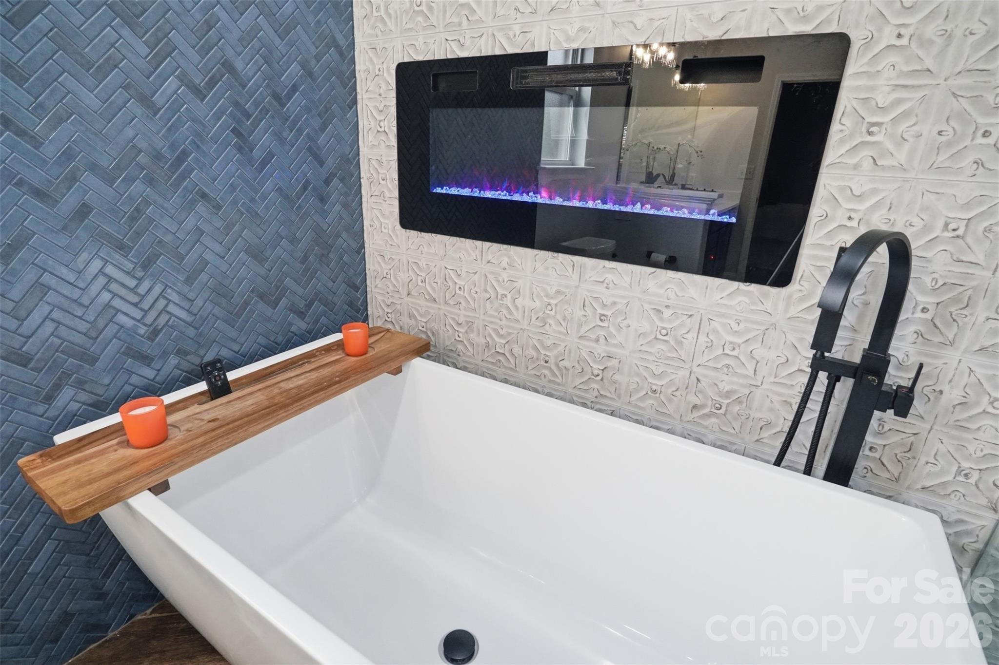 Modern soaking tub with electric fireplace that changes colors with the remote! - 835 Estuary Court, Rock Hill